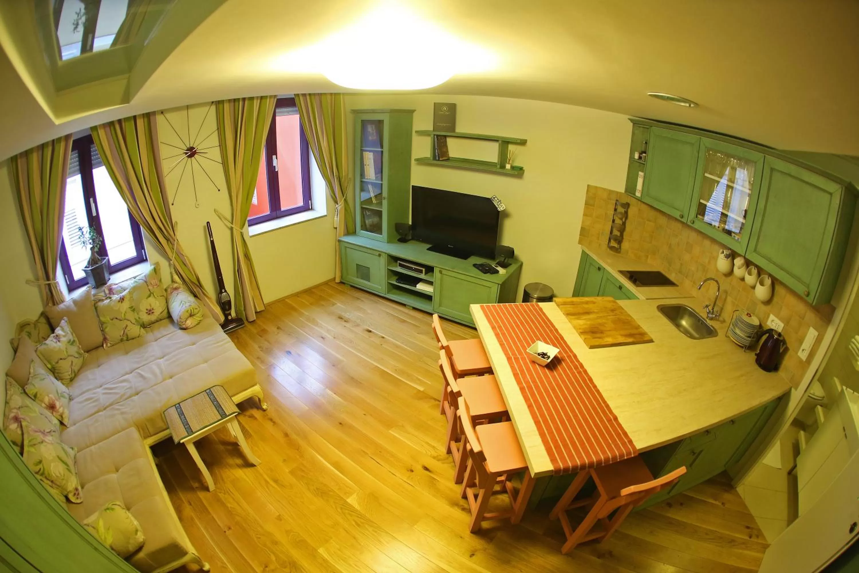 TV and multimedia in Central Apartments Integrated Hotel