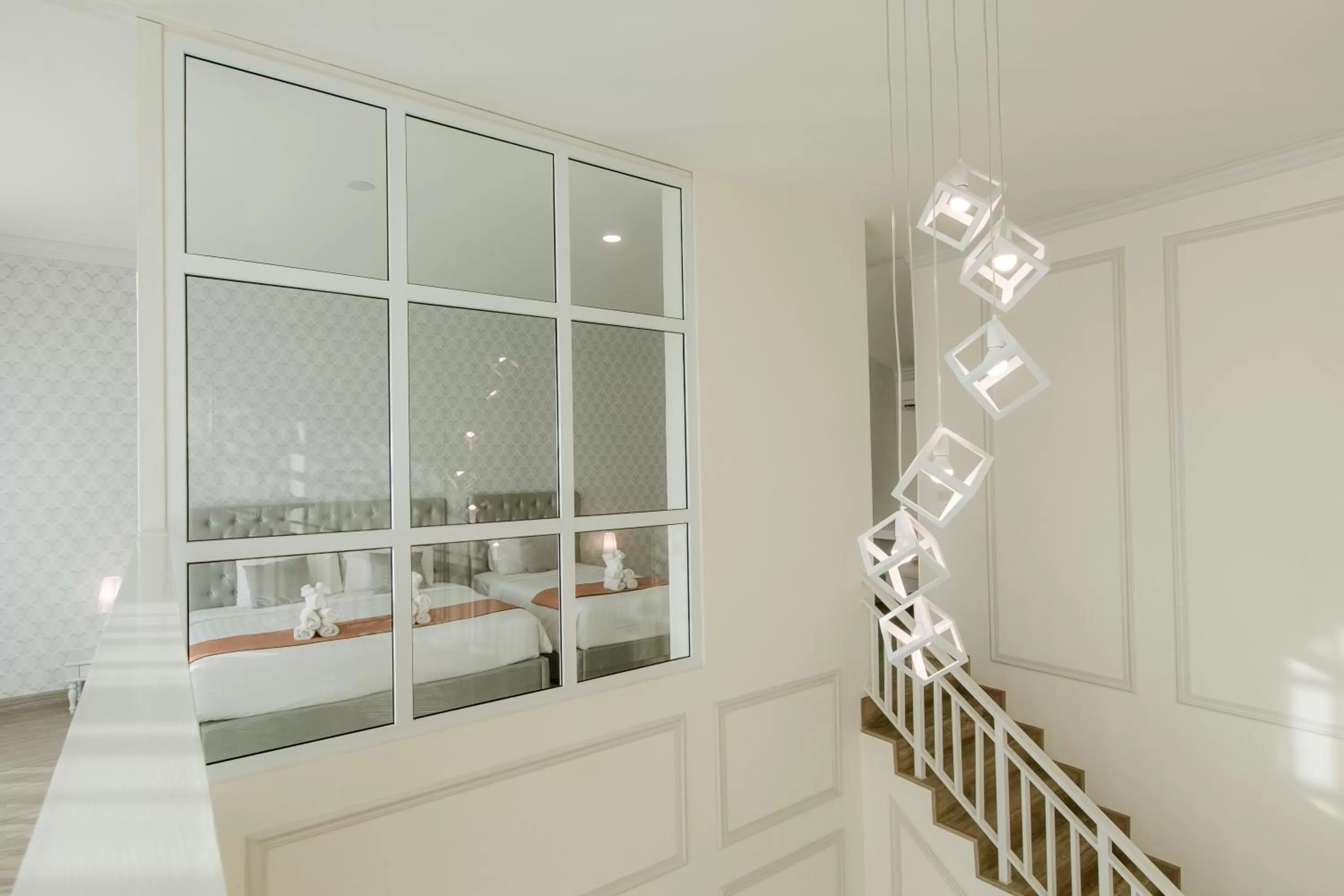 Bed in De Hug Hotel & Residence