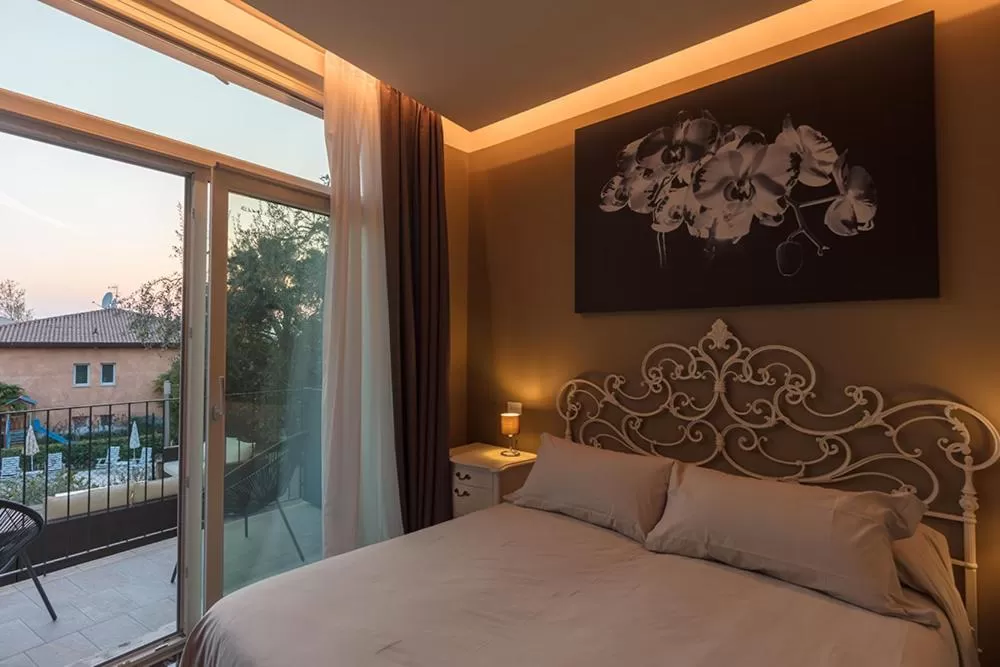 Bed in Art Hotel Ventaglio