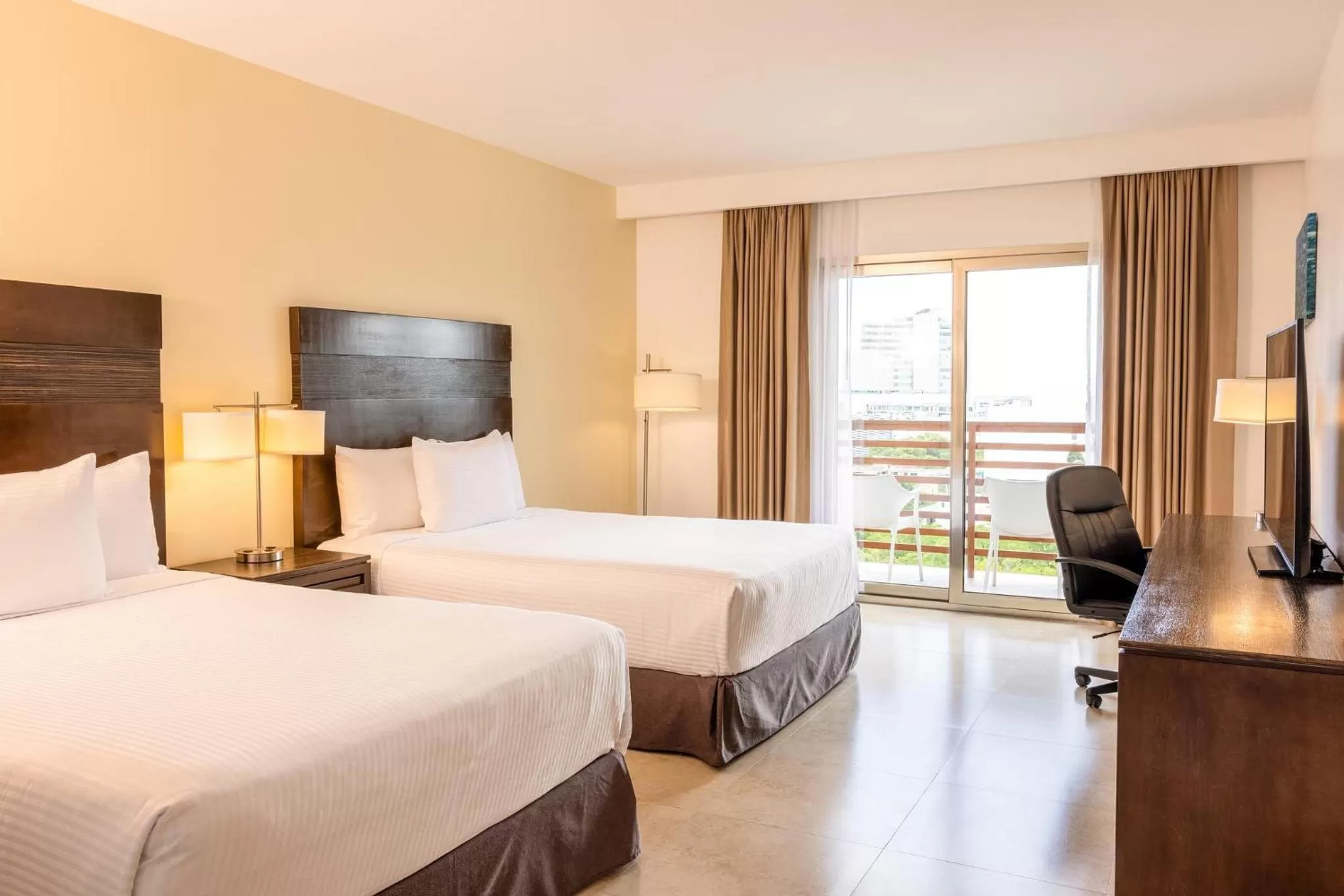 Bed in Wyndham Garden Cancun Downtown