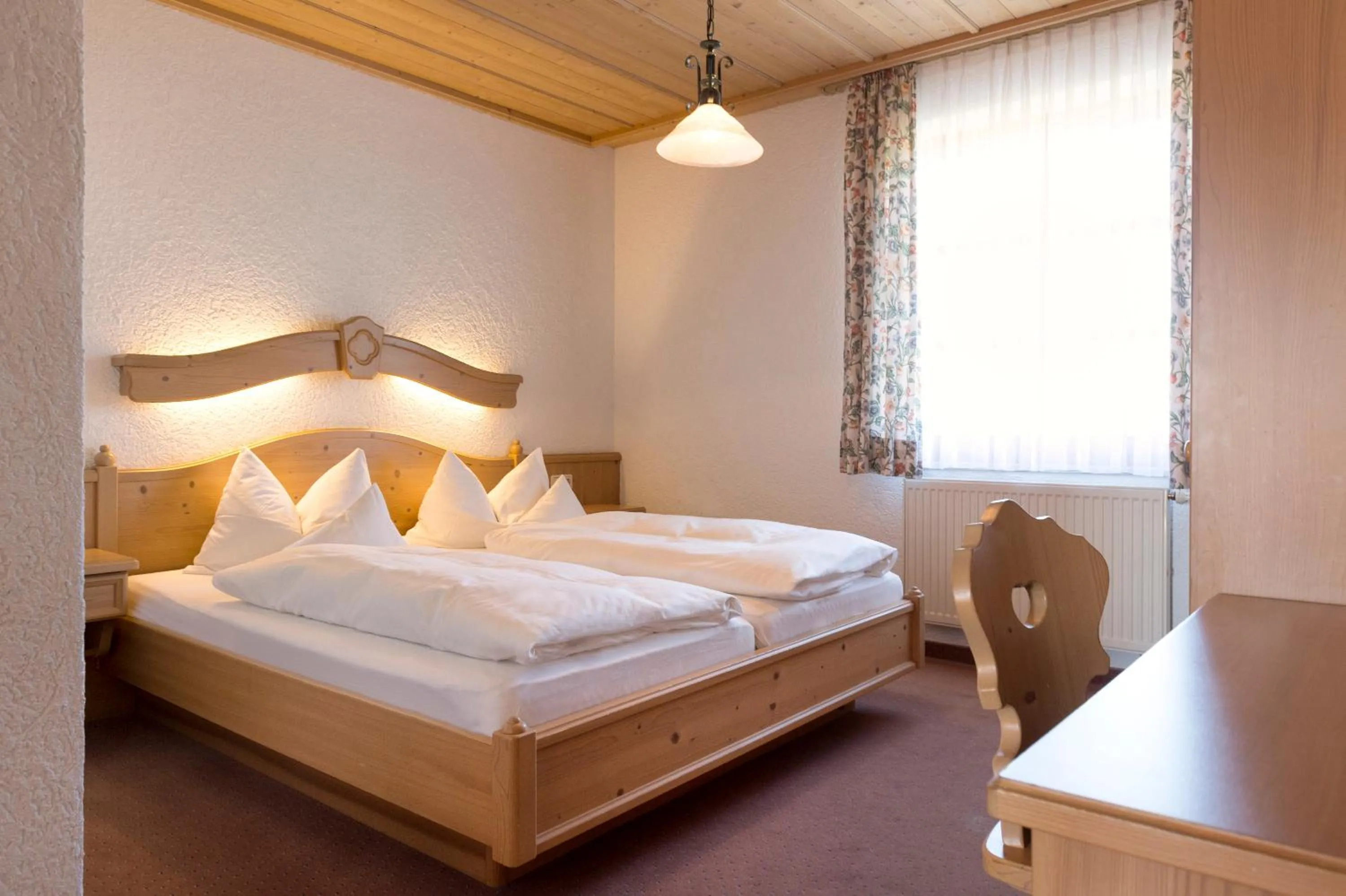 Photo of the whole room, Bed in Landhotel Postwirt