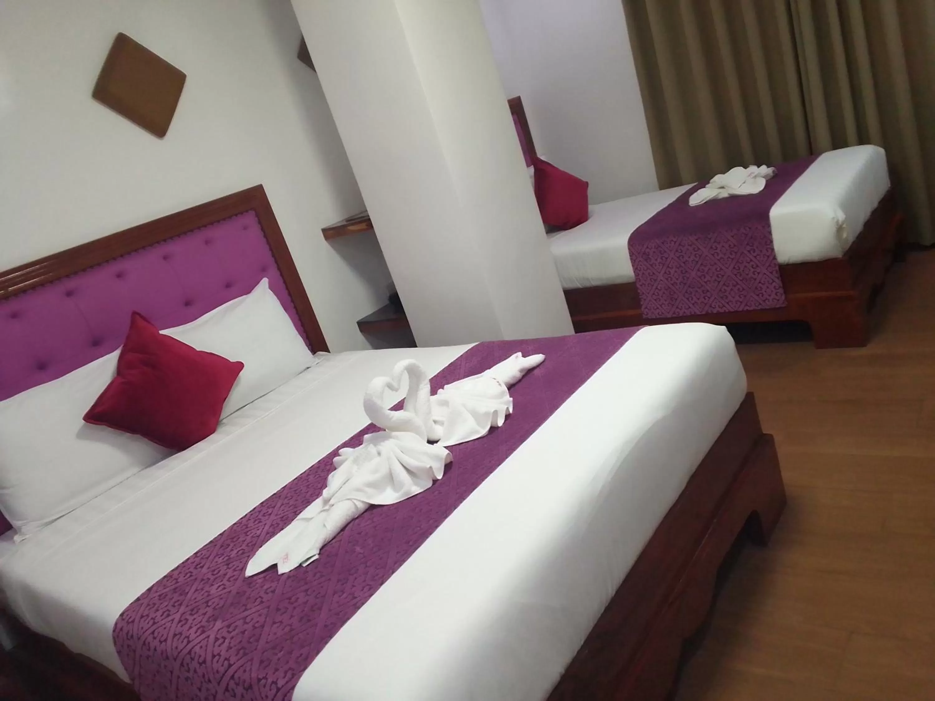 Bed in CLN Boutique Hotel