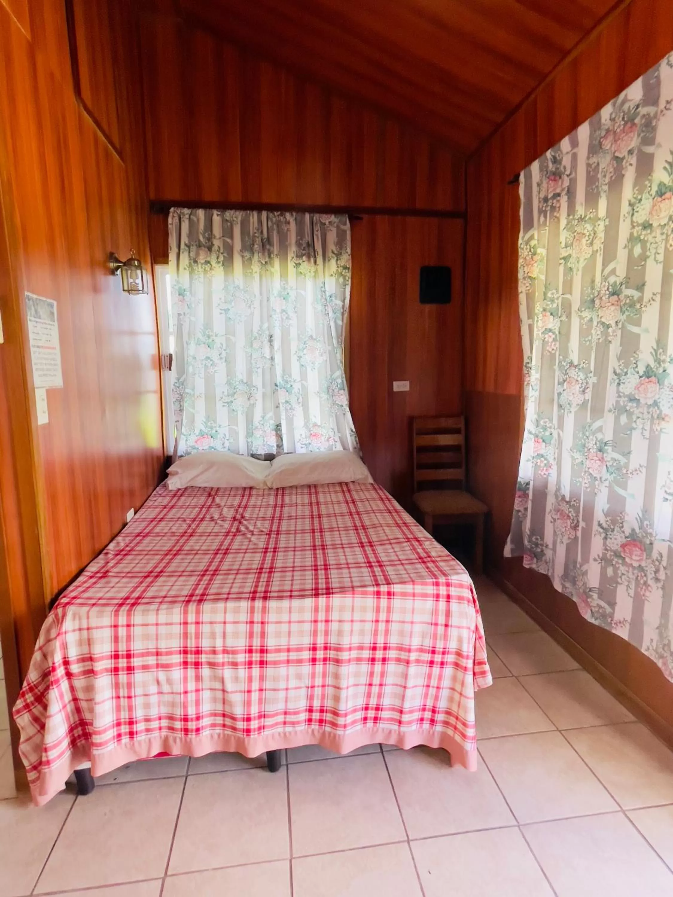 Bed in Lamanai Riverside Retreat