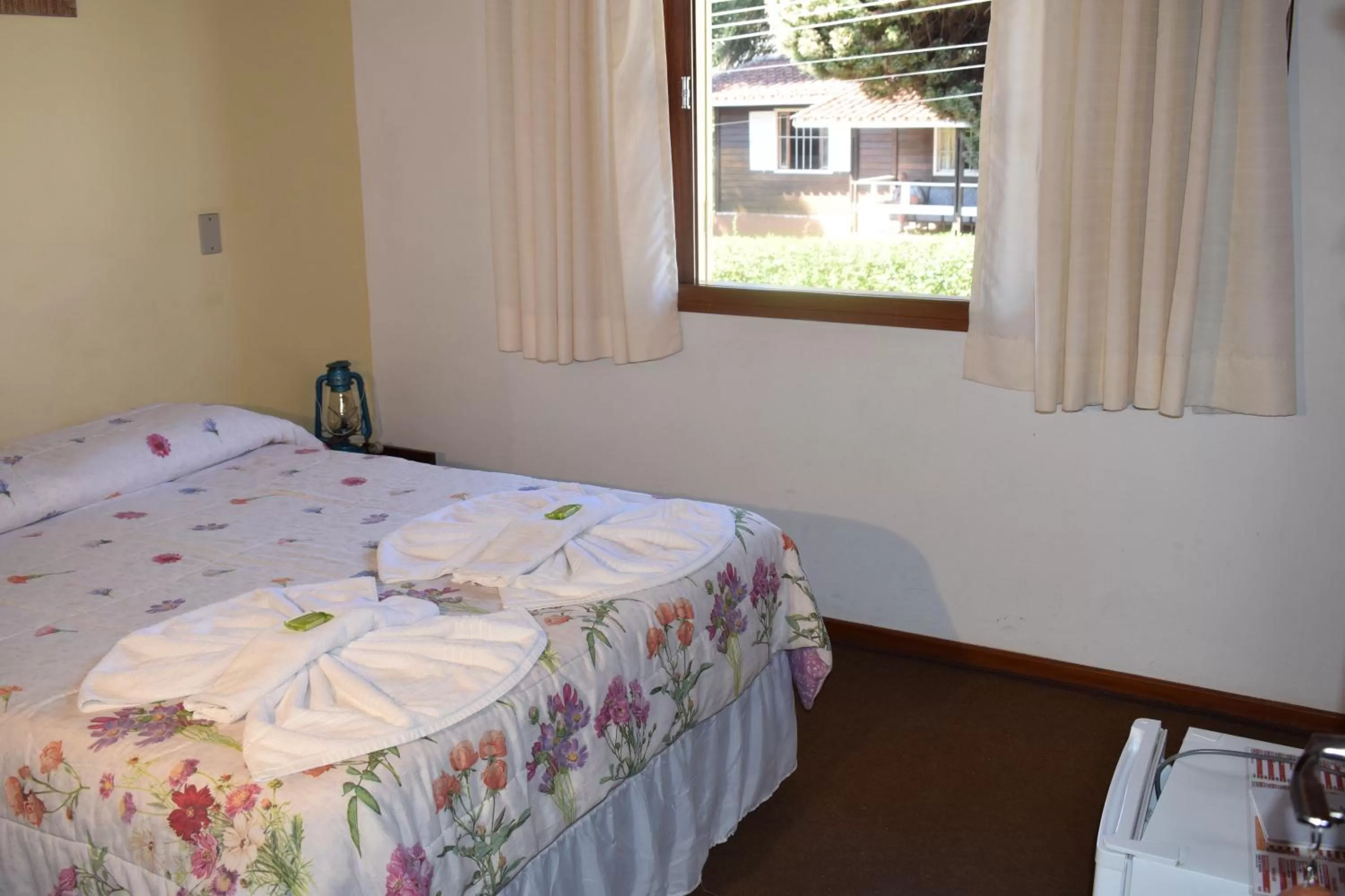 Bed in Pousada Curumi