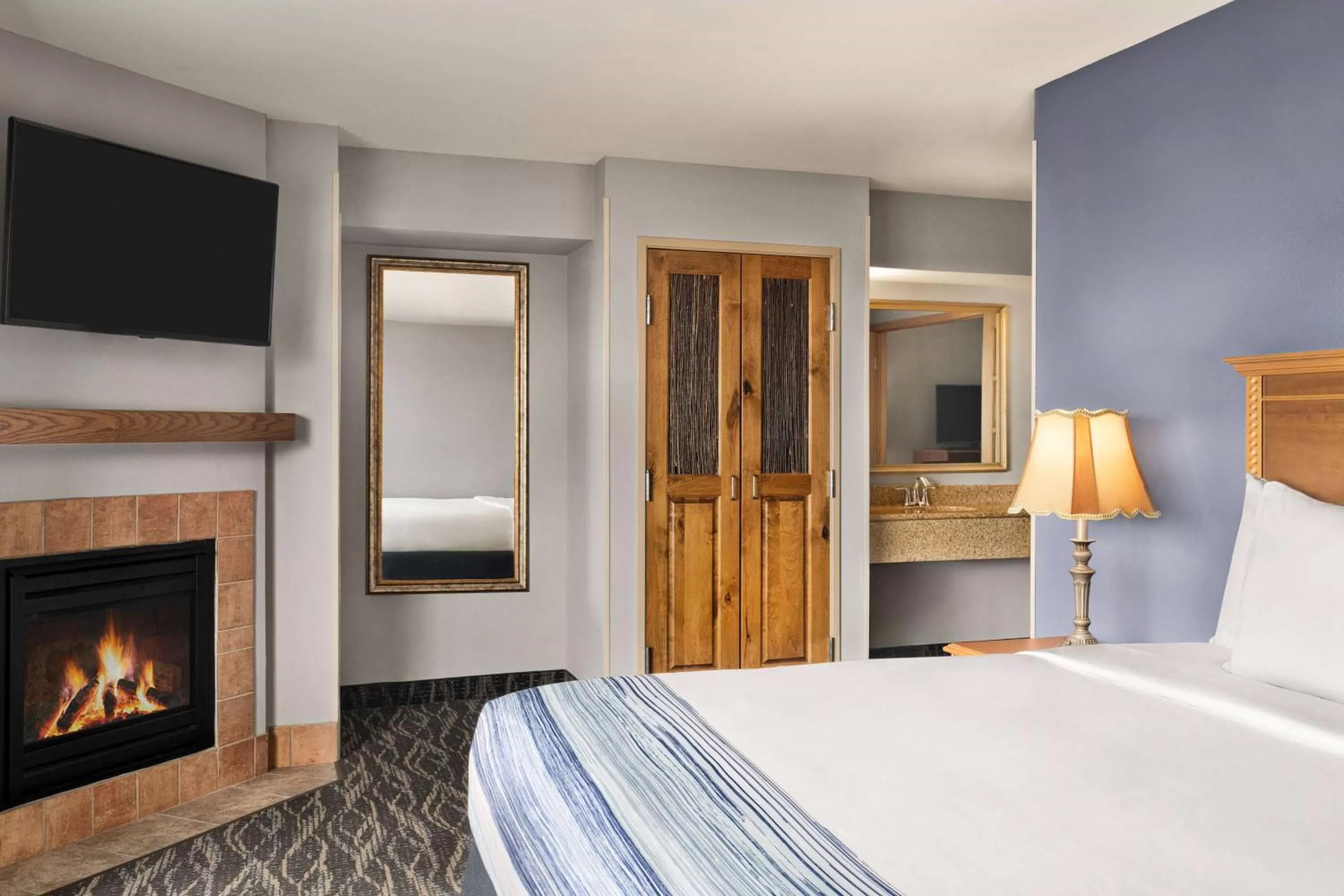 Bed in AmericInn by Wyndham Laramie Near University of Wyoming