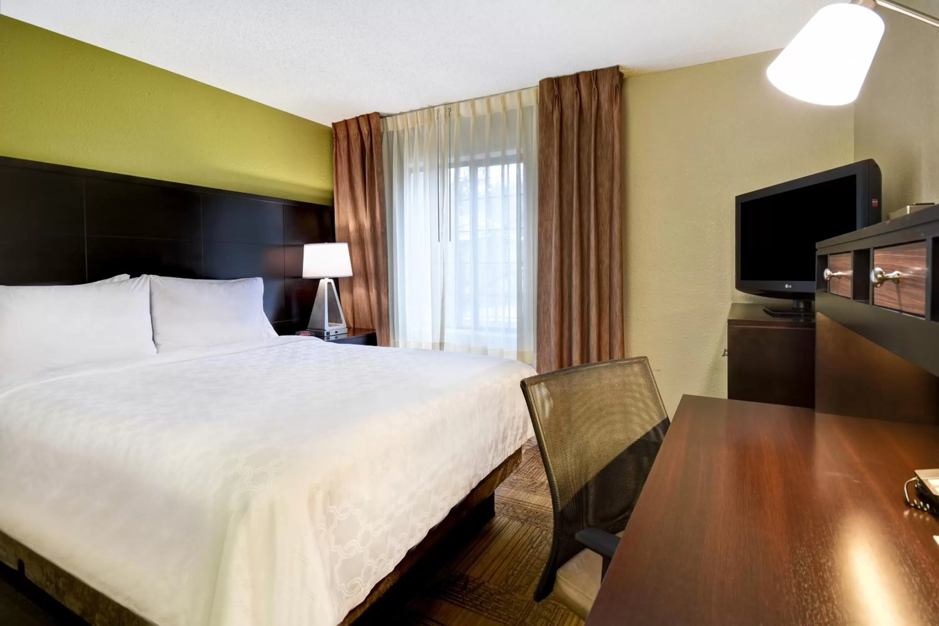 Two-Bedroom Suite with One King and One Queen in Staybridge Suites Grand Rapids-Kentwood, an IHG Hotel