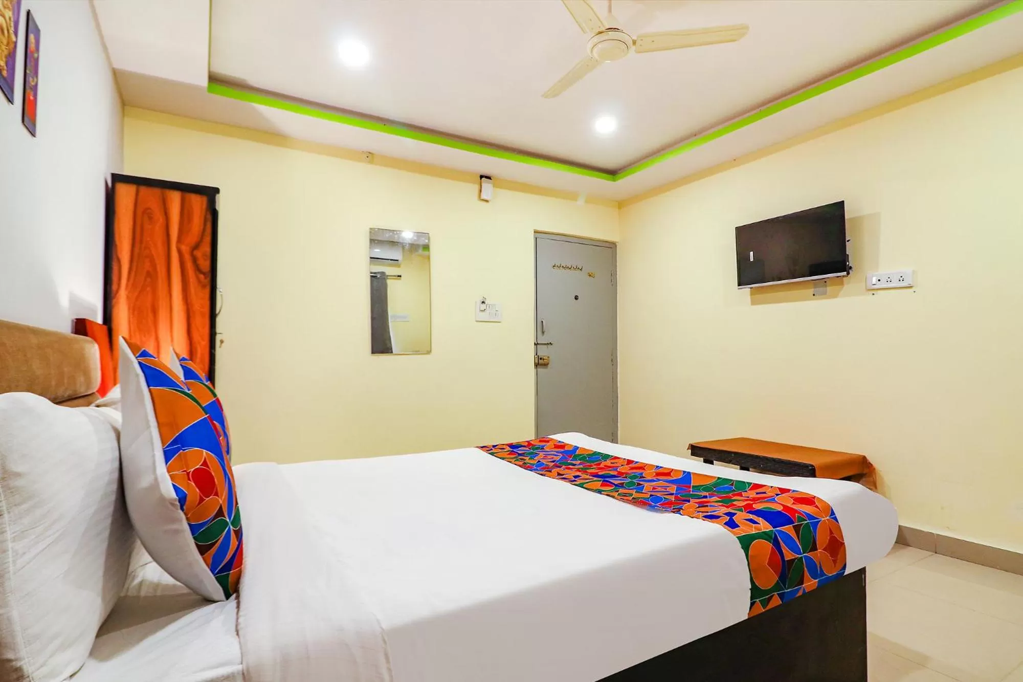 Communal lounge/ TV room, Bed in FabExpress Broholic Suites - Nr JNTU Kukatpally