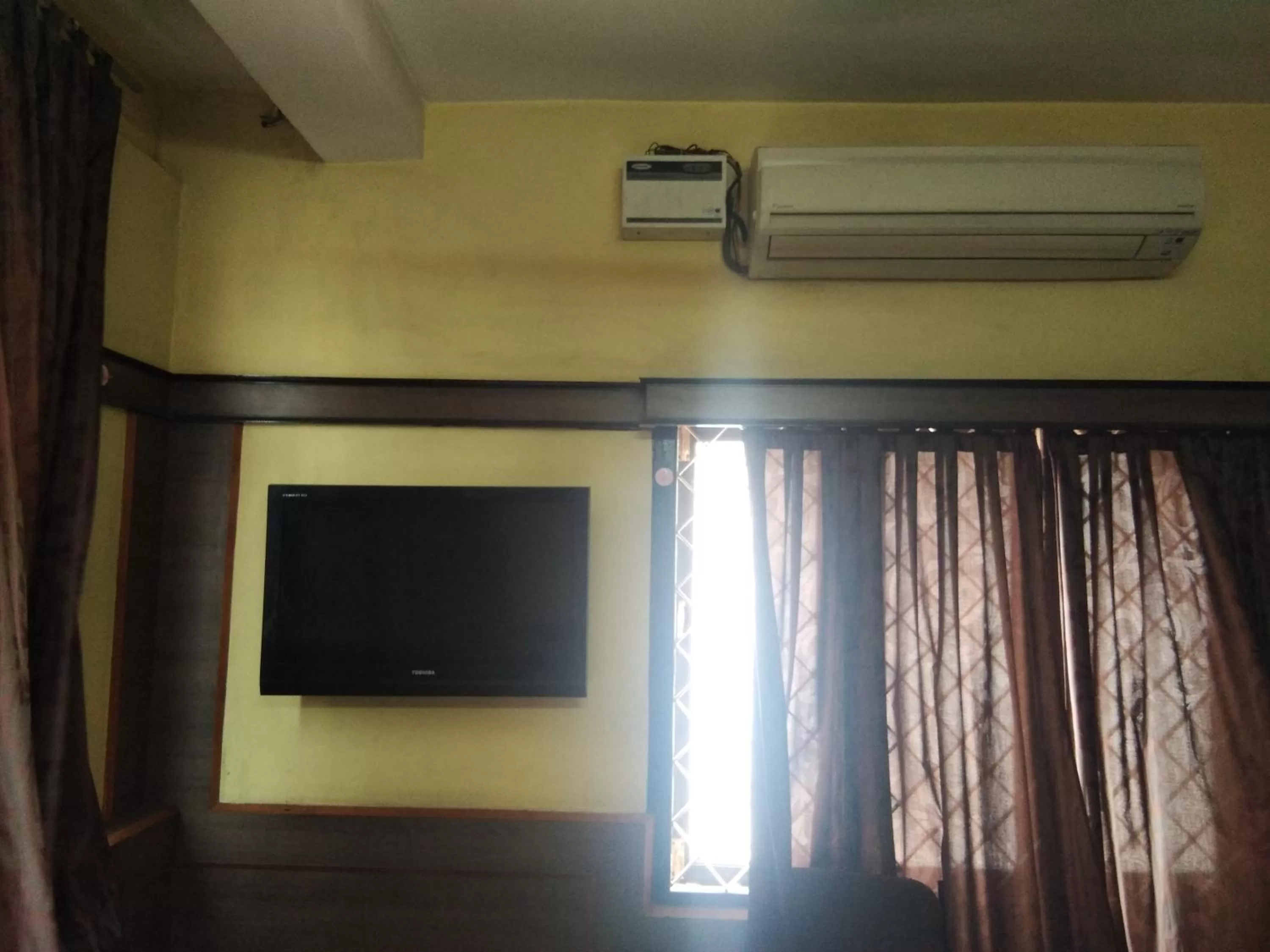 Bedroom, TV/Entertainment Center in Sri Saraswathi Lodge