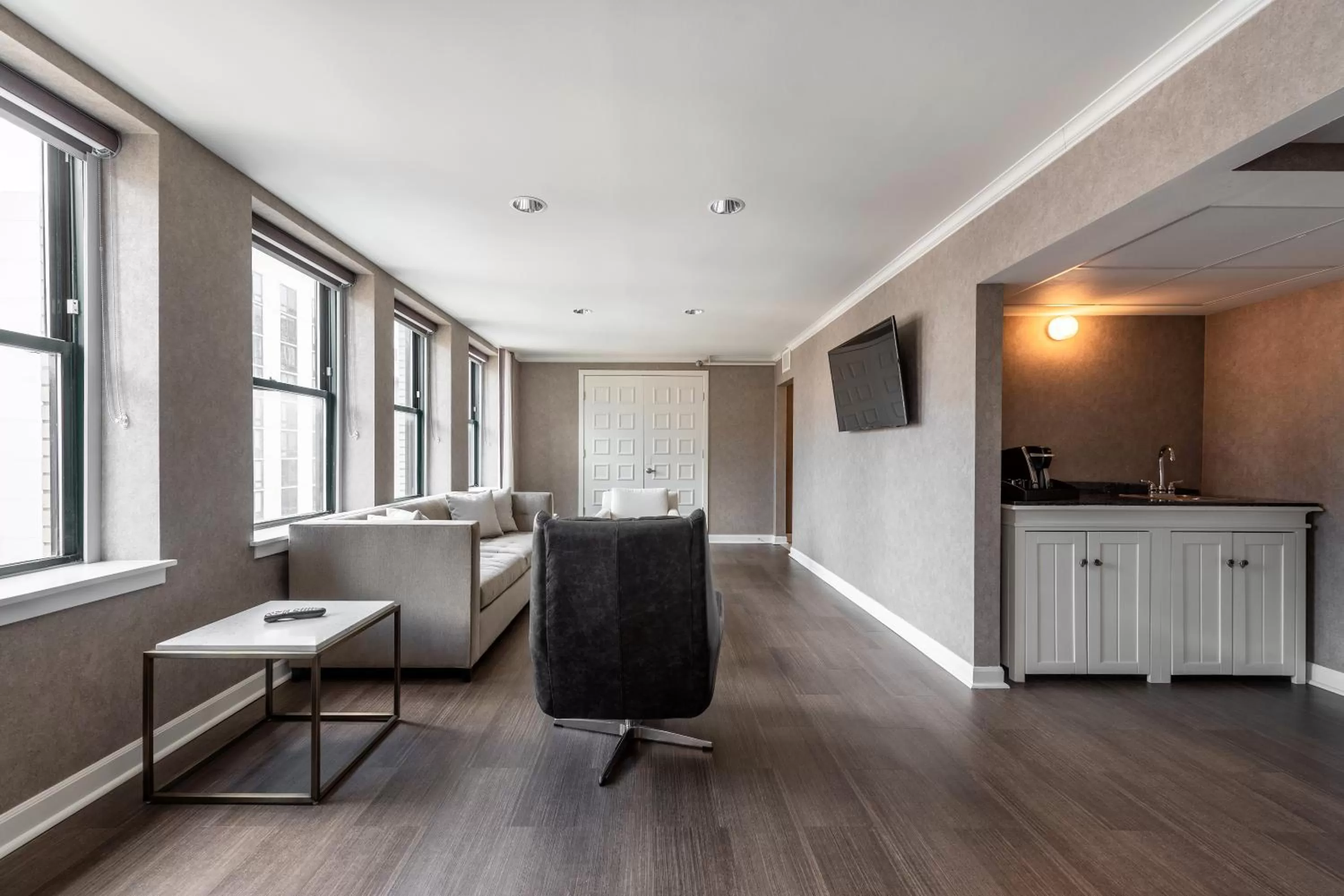 Living room in Claridge House Chicago, Tapestry Collection by Hilton