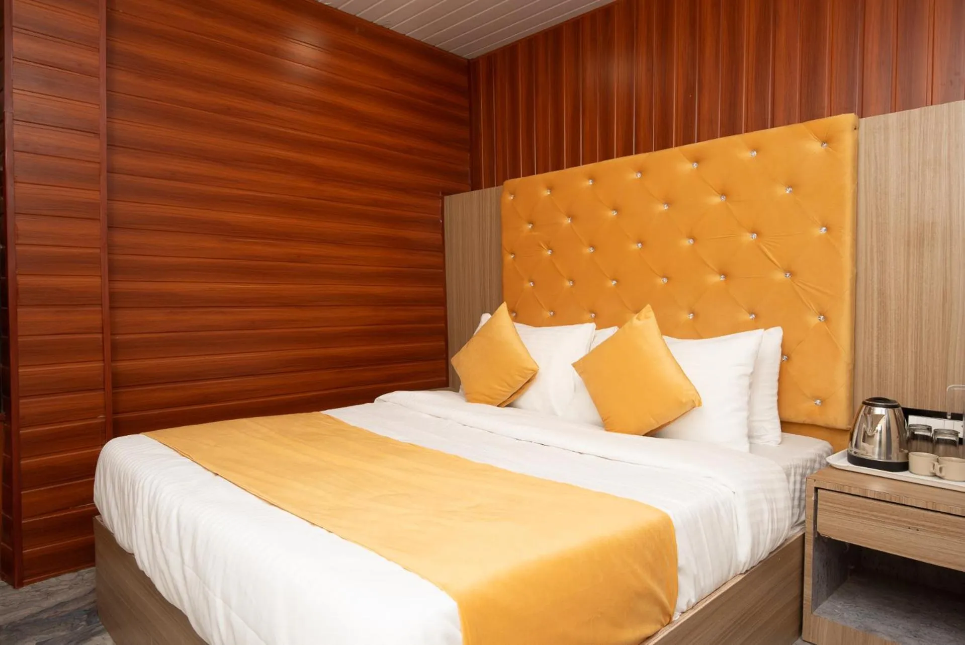 Bed in Hotel Priceless Suite-Nesco Exhibition Goregaon