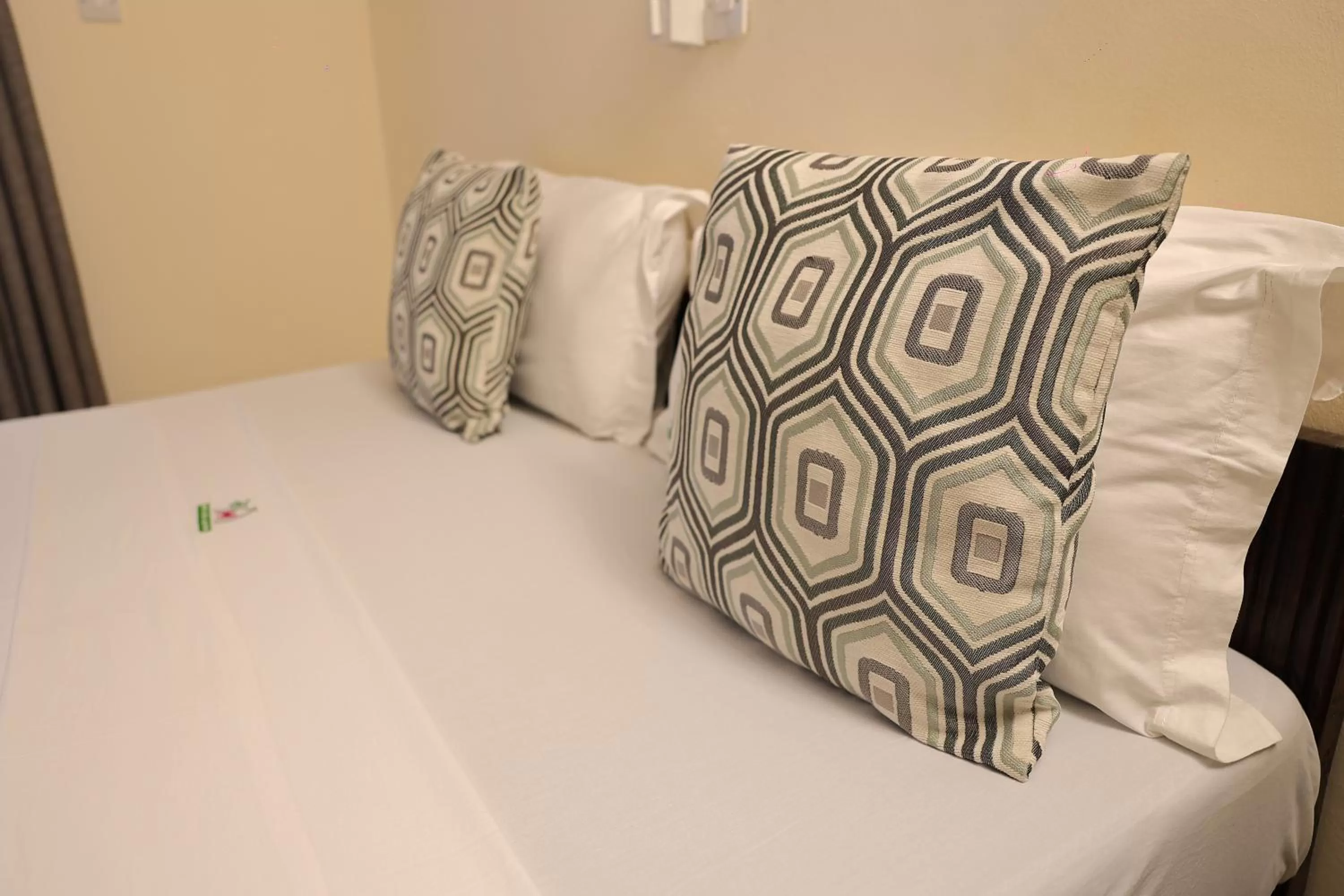 Bed in Merry Villa Hotel & Apartments