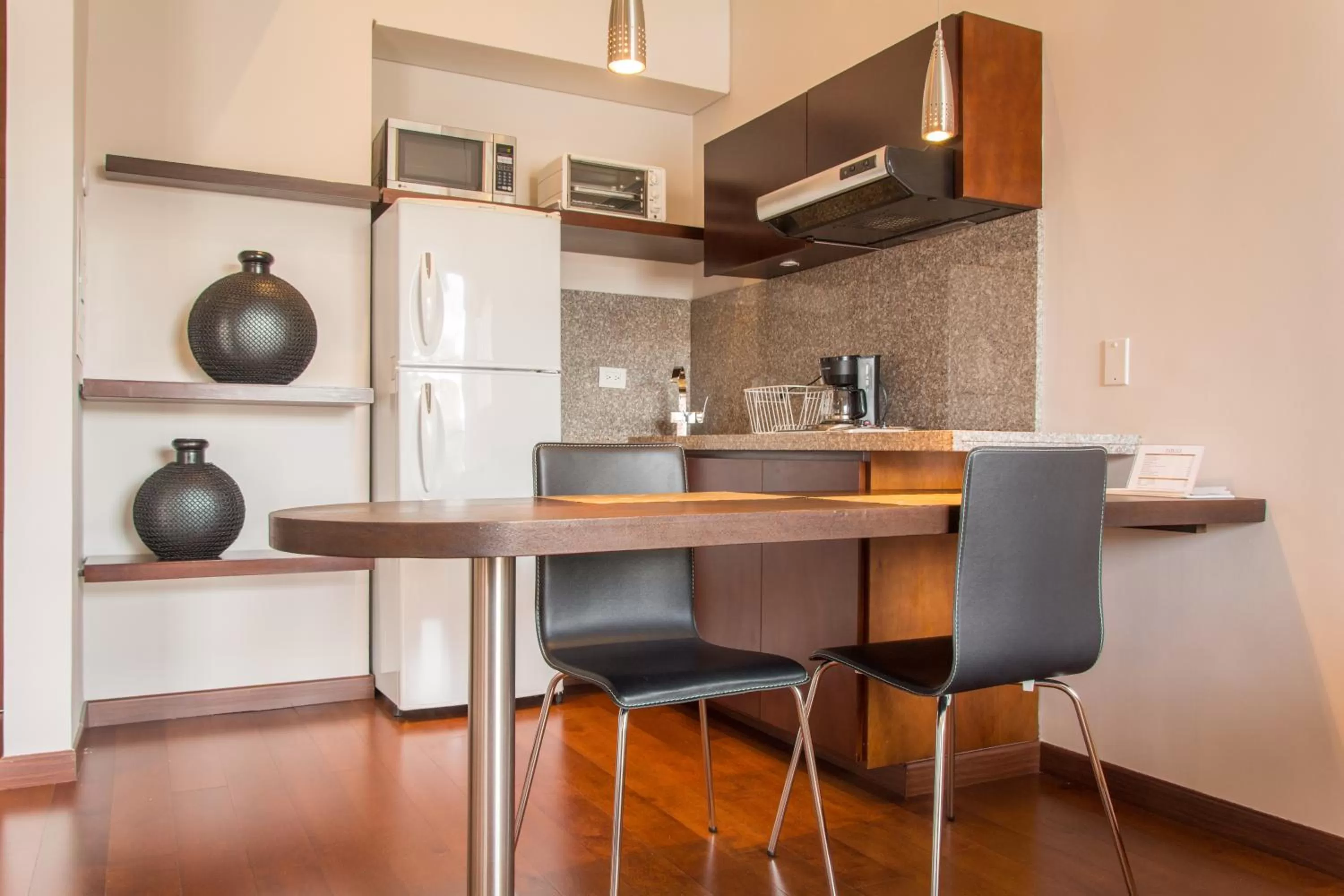 Kitchen or kitchenette in Nico Apartasuites