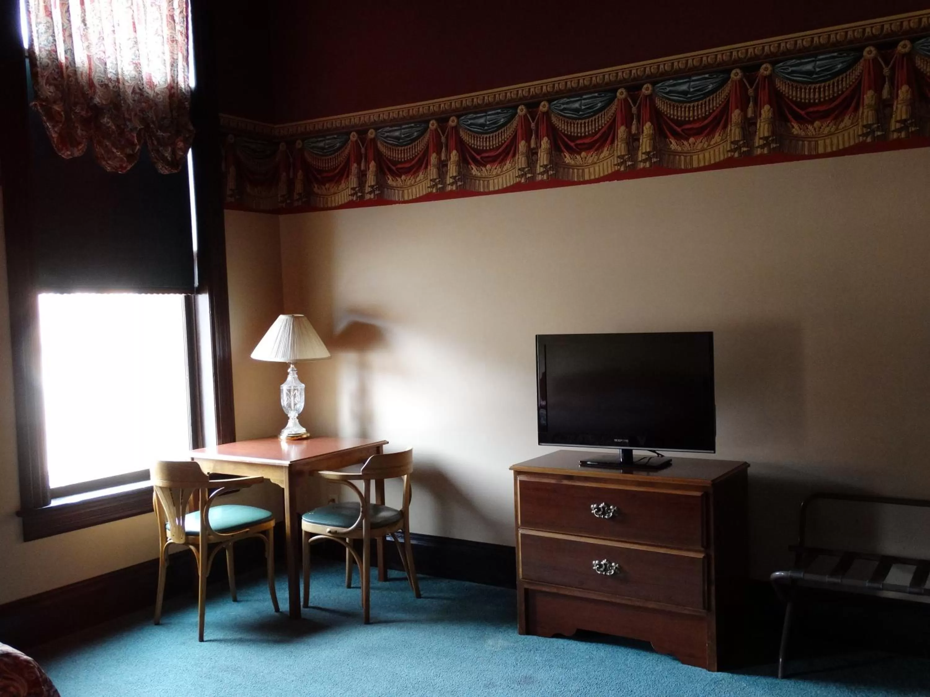 Seating area, TV/Entertainment Center in Historic Iron Horse Inn - Deadwood