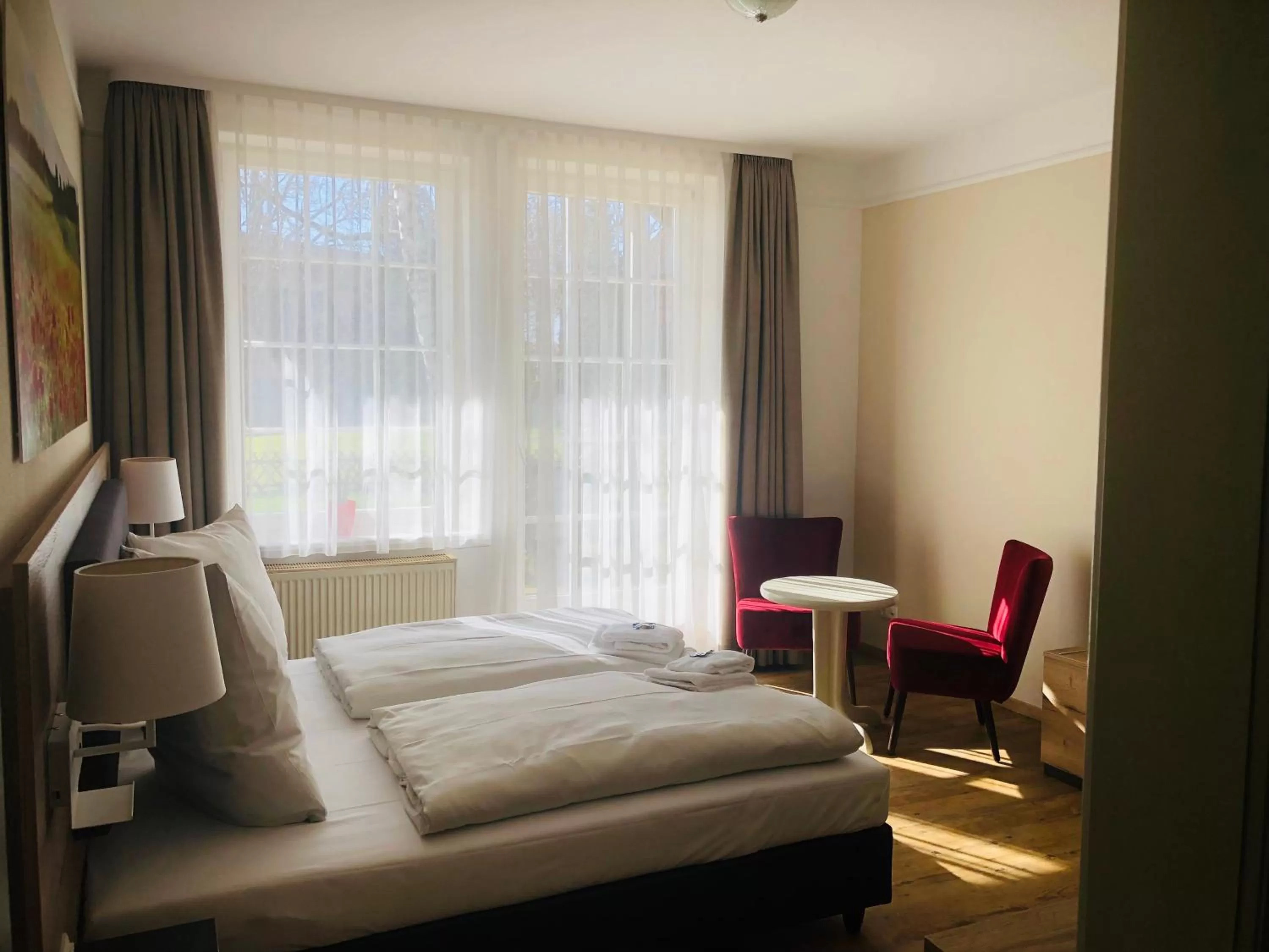 Photo of the whole room, Bed in Landhotel Gutshof im Oertzetal in Oldendorf, Südheide