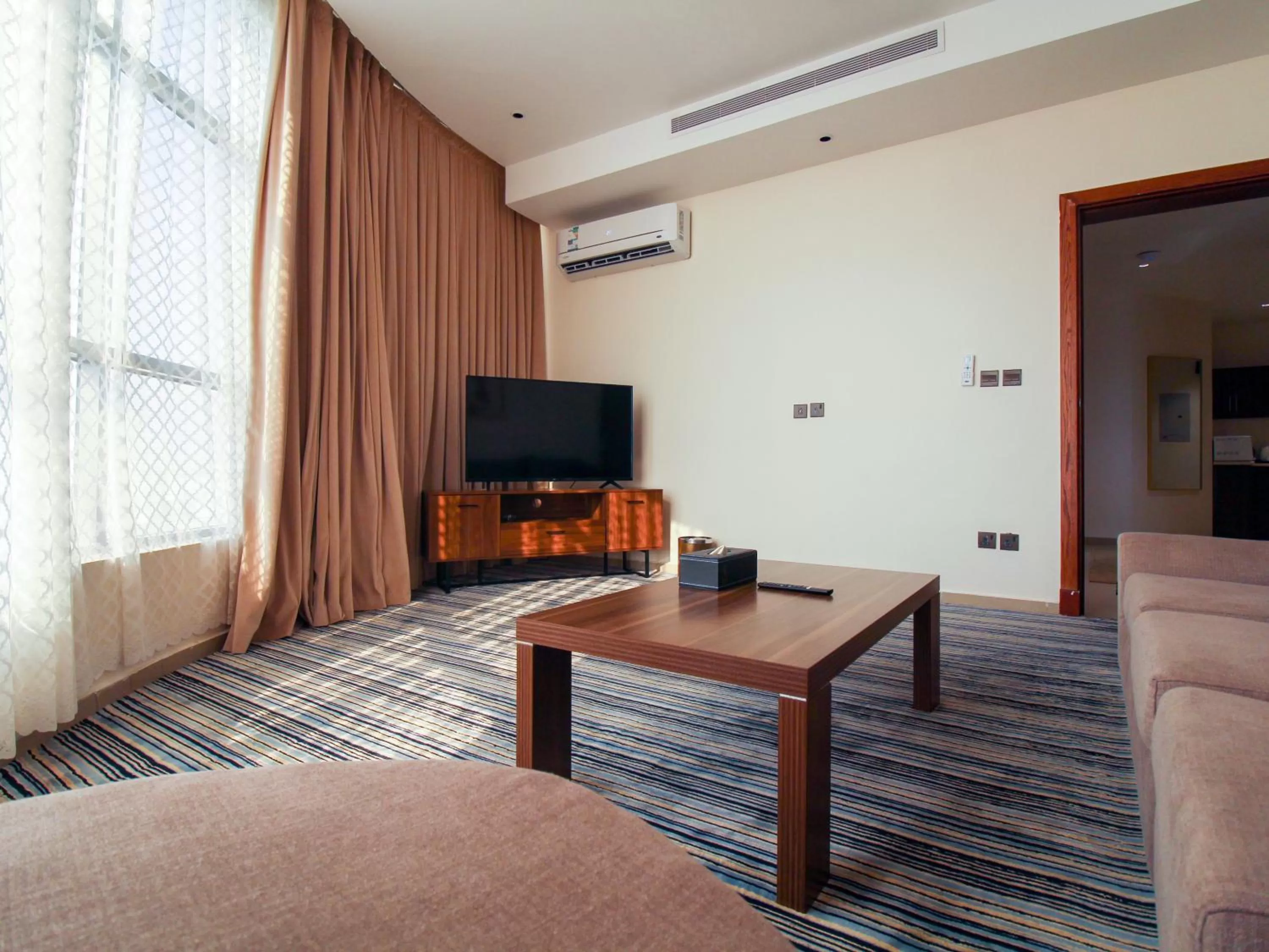 TV/Entertainment Center in Friesian Hotel Suites