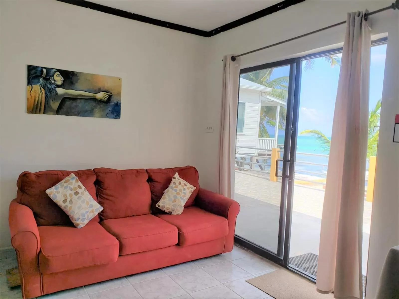 Seating Area in Beach Side Condos Caye Caulker by CCVH