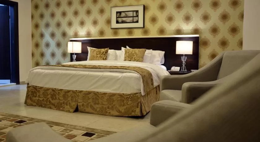 Bed in City Rose Hotel Suites