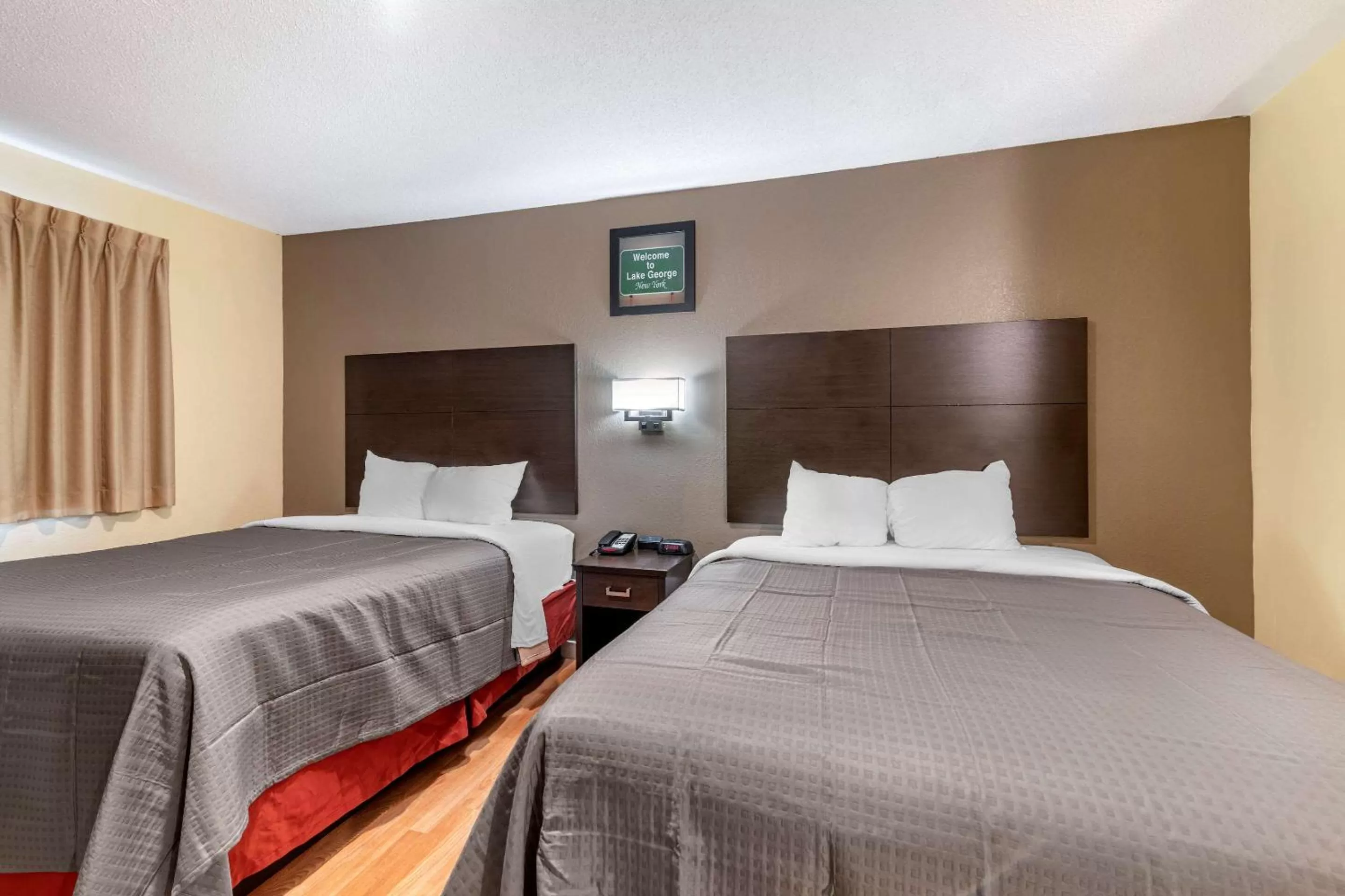 Photo of the whole room, Bed in Rodeway Inn Lake George Outlets