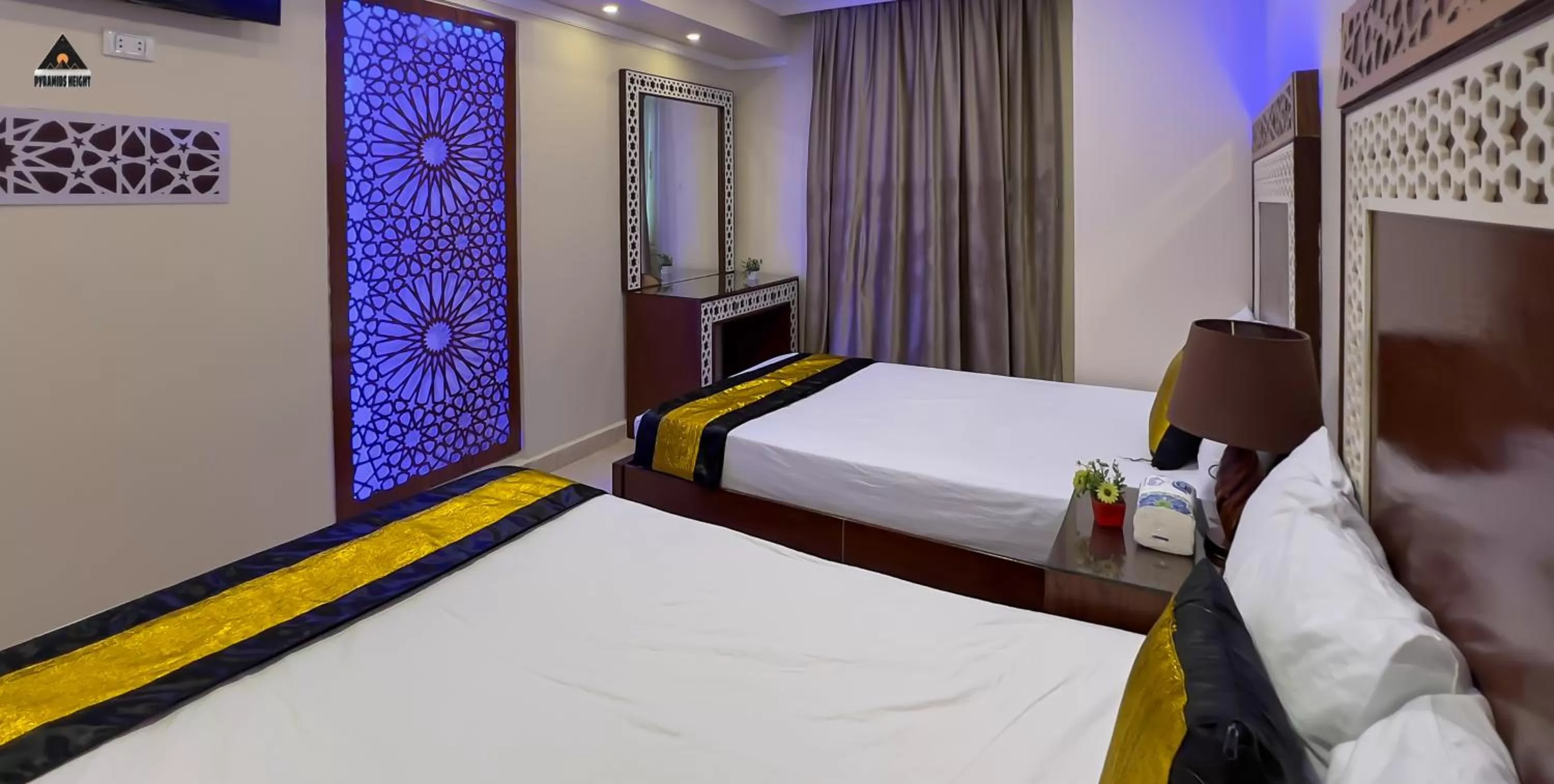 Bed in Pyramids Height Hotel & Pyramids Master Scene Rooftop