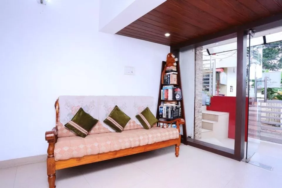 Seating area, Bed in Swapnatheeram Beach Resort