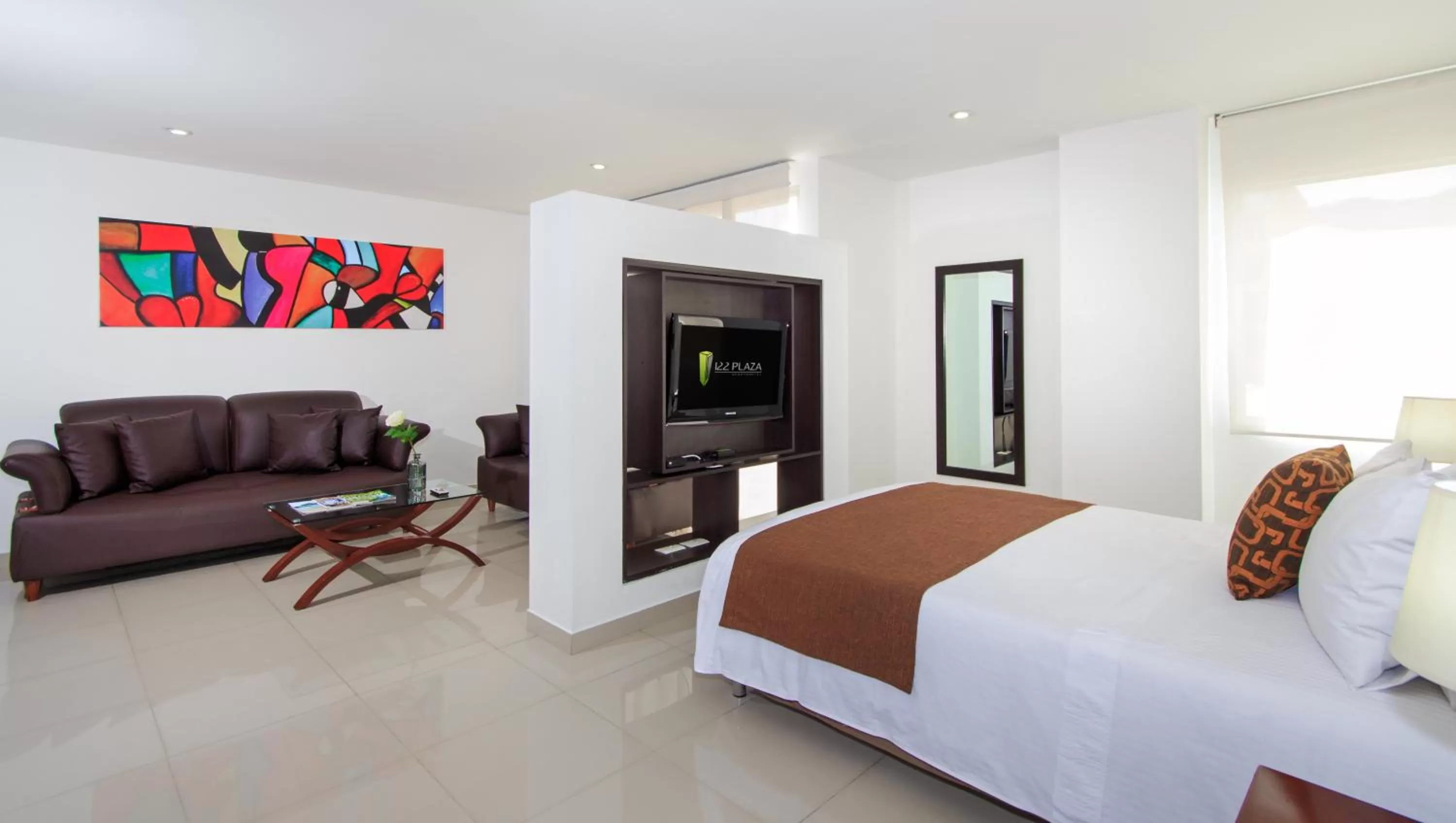 Living room, Bed in 122 Plaza Apartahotel