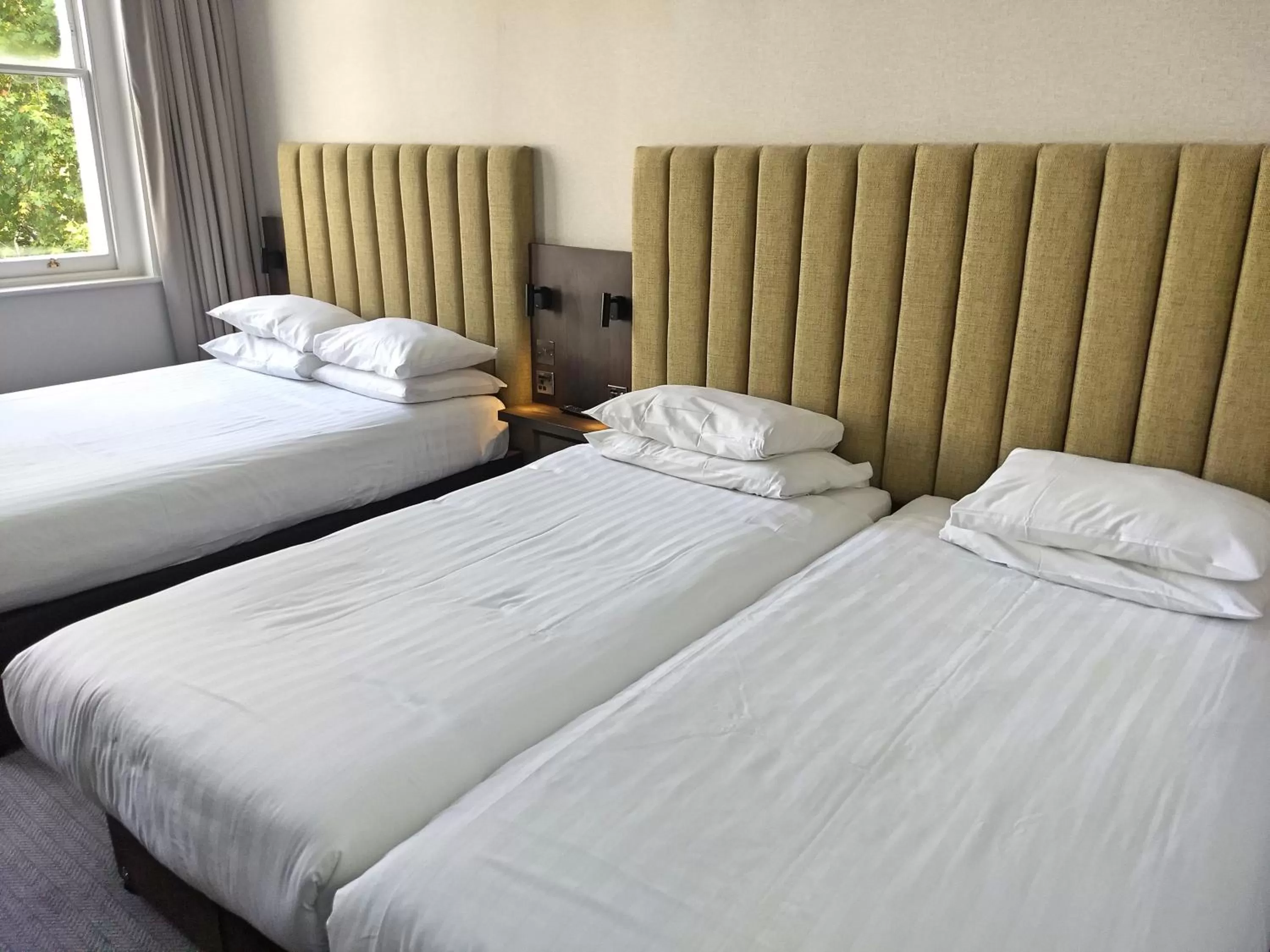 Bed in Garden Court Hotel