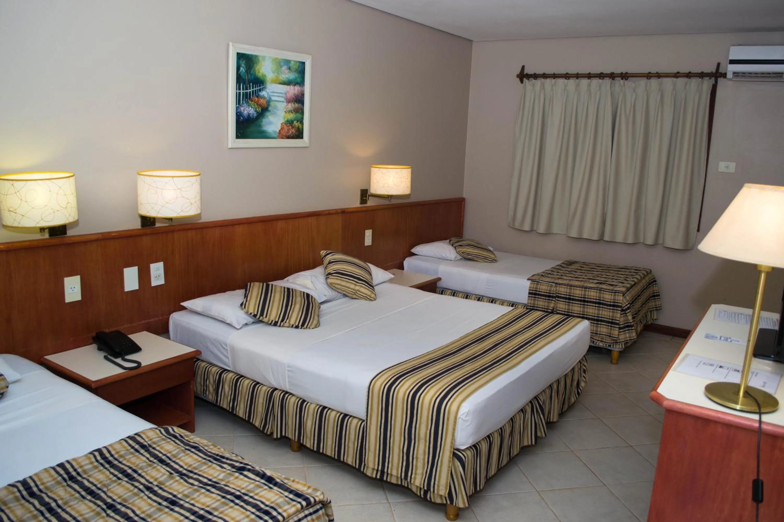 Bed in Marcopolo Suites Iguazu