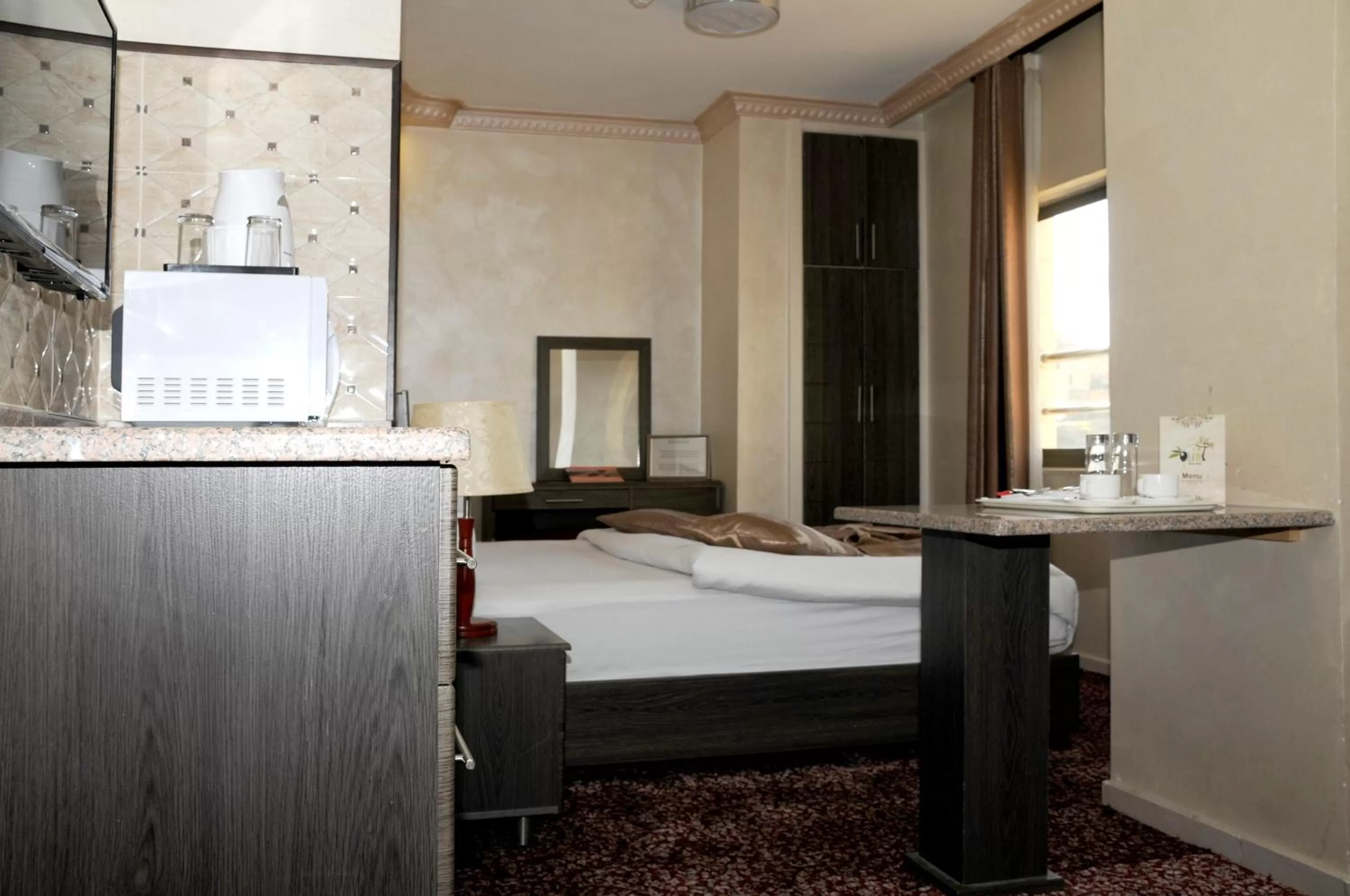 Bed in Olive Hotel Amman