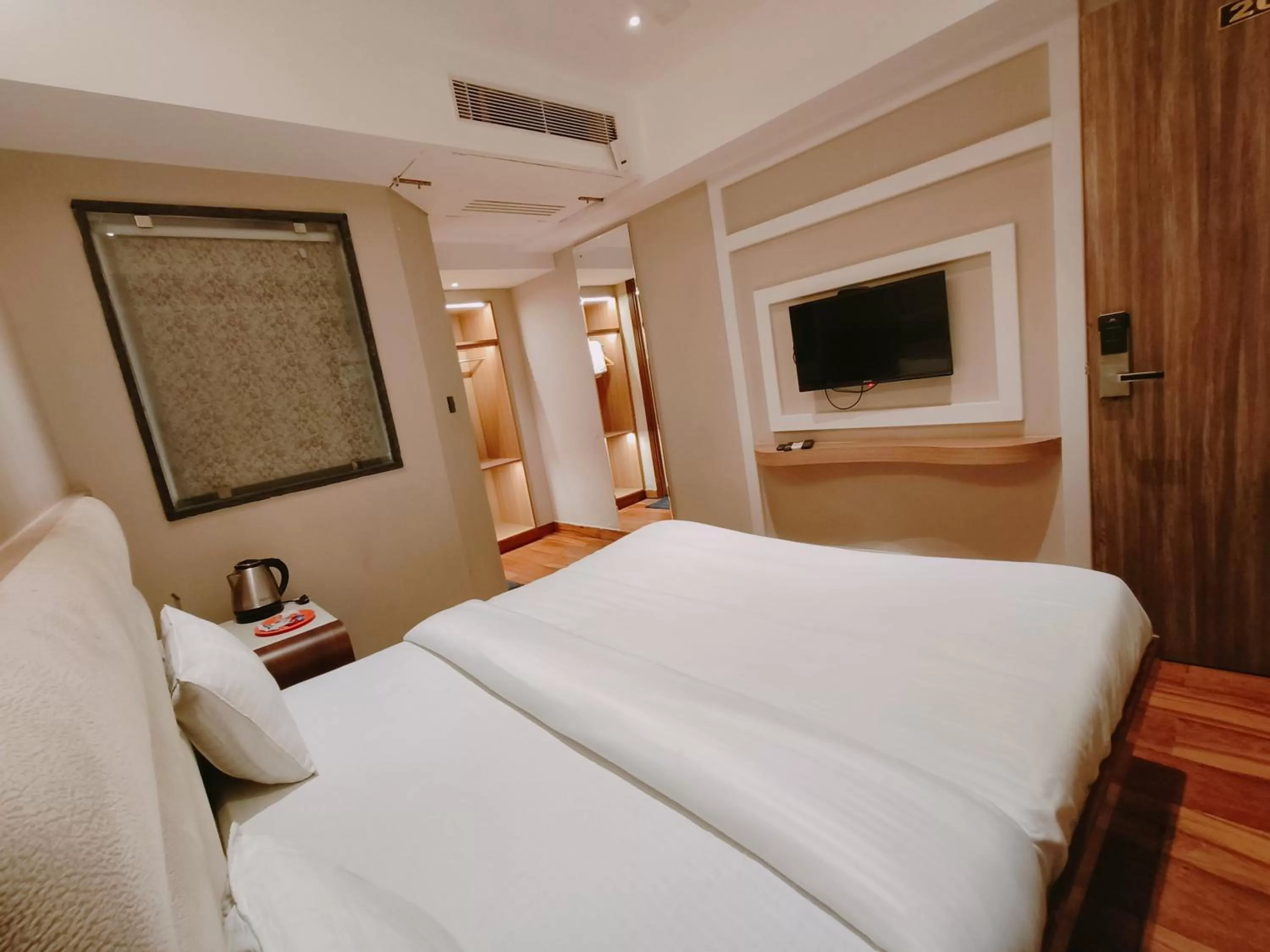 Bed in Aura Rooms