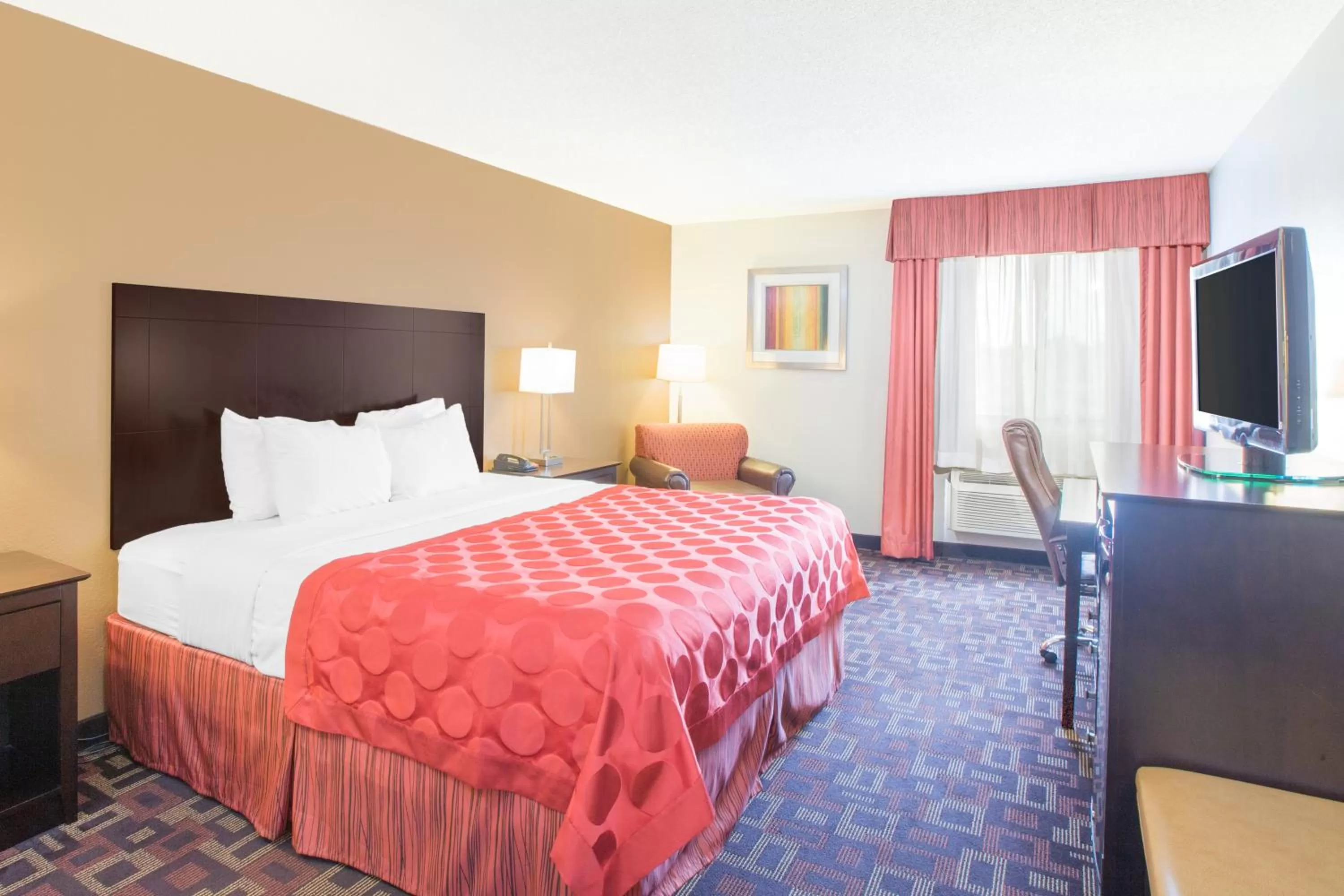 Bed in Ramada by Wyndham Tulsa