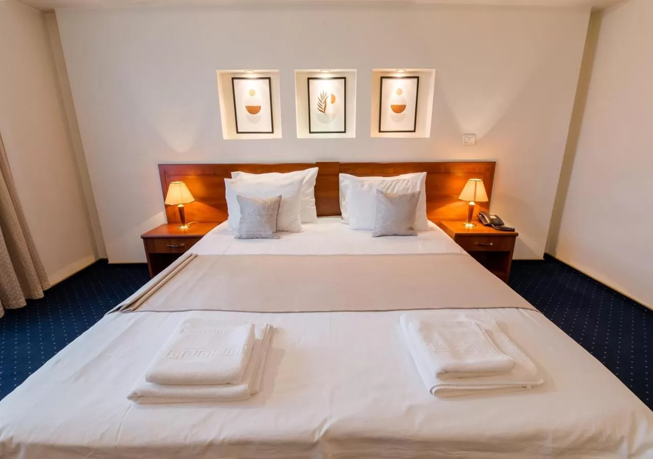 Bed in Hotel Excelsior By TimHotels