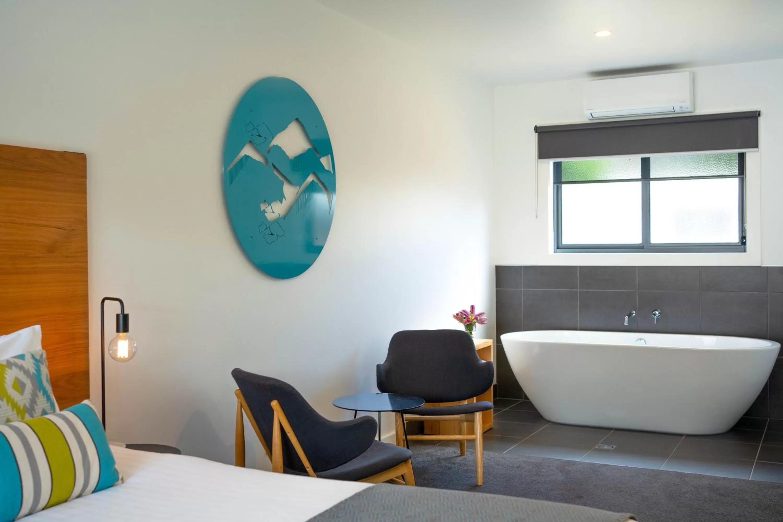 Bed in Bright Colonial Motel