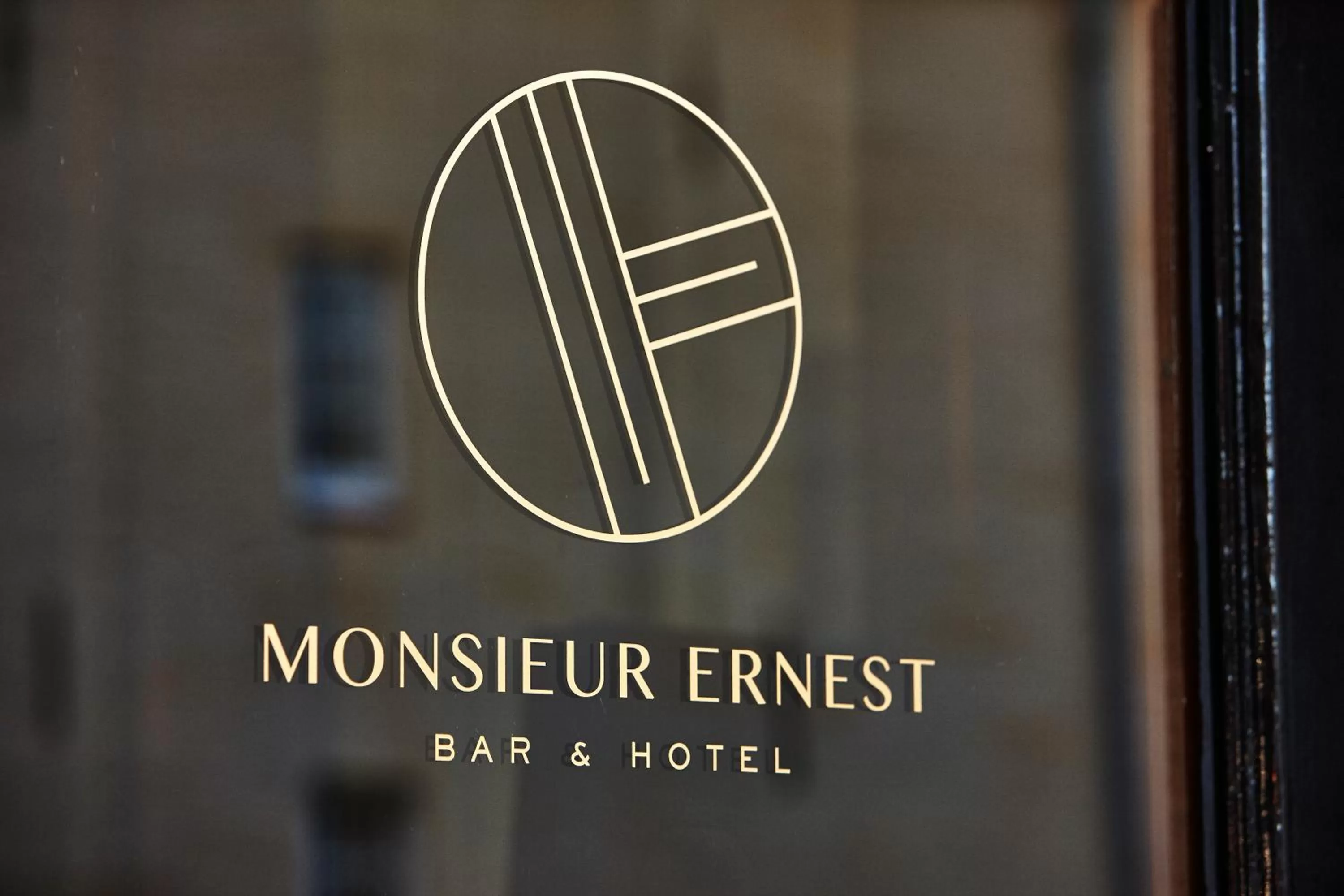 Property logo or sign in Hotel Monsieur Ernest