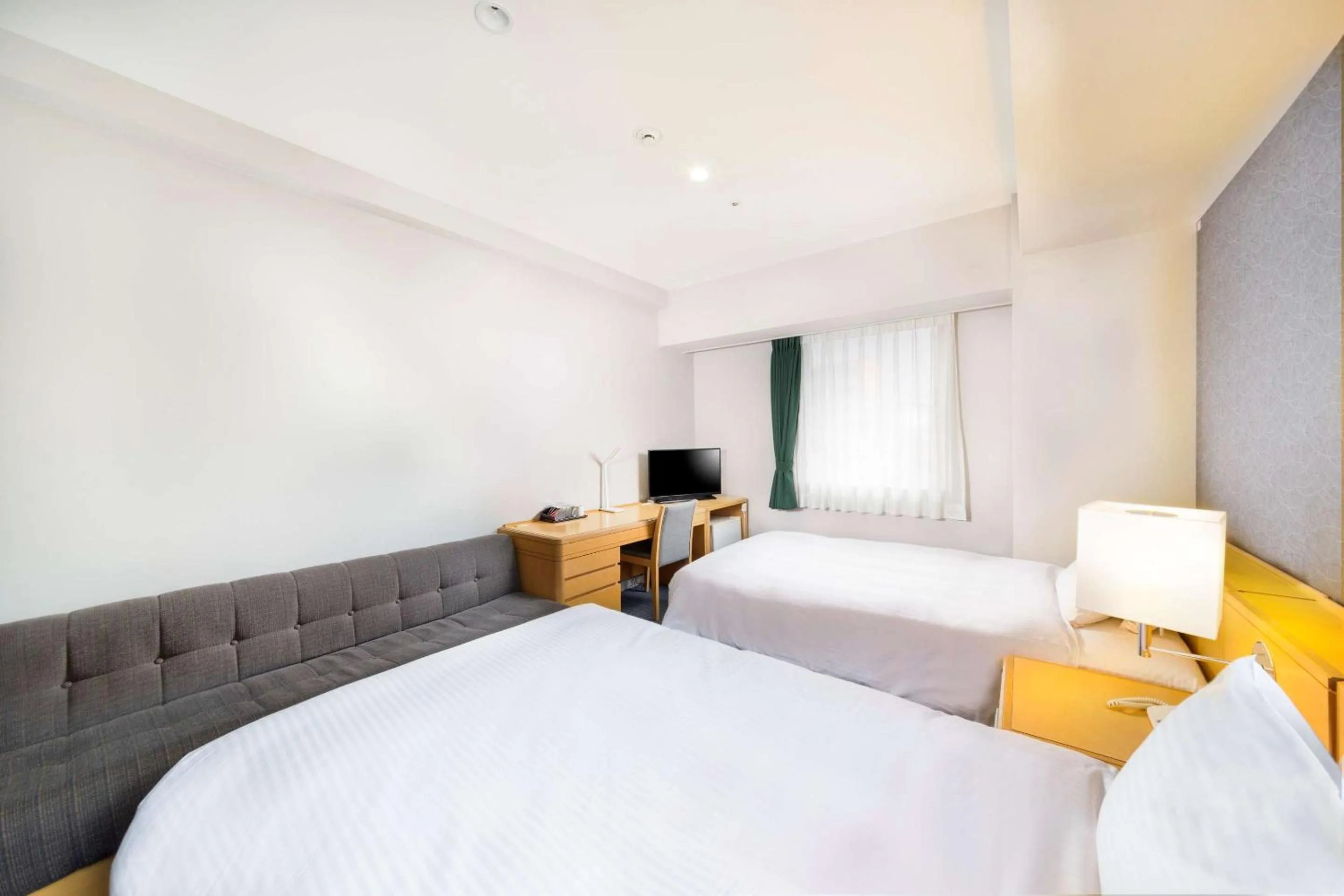 Bedroom in SureStay Plus Hotel by Best Western Shin-Osaka
