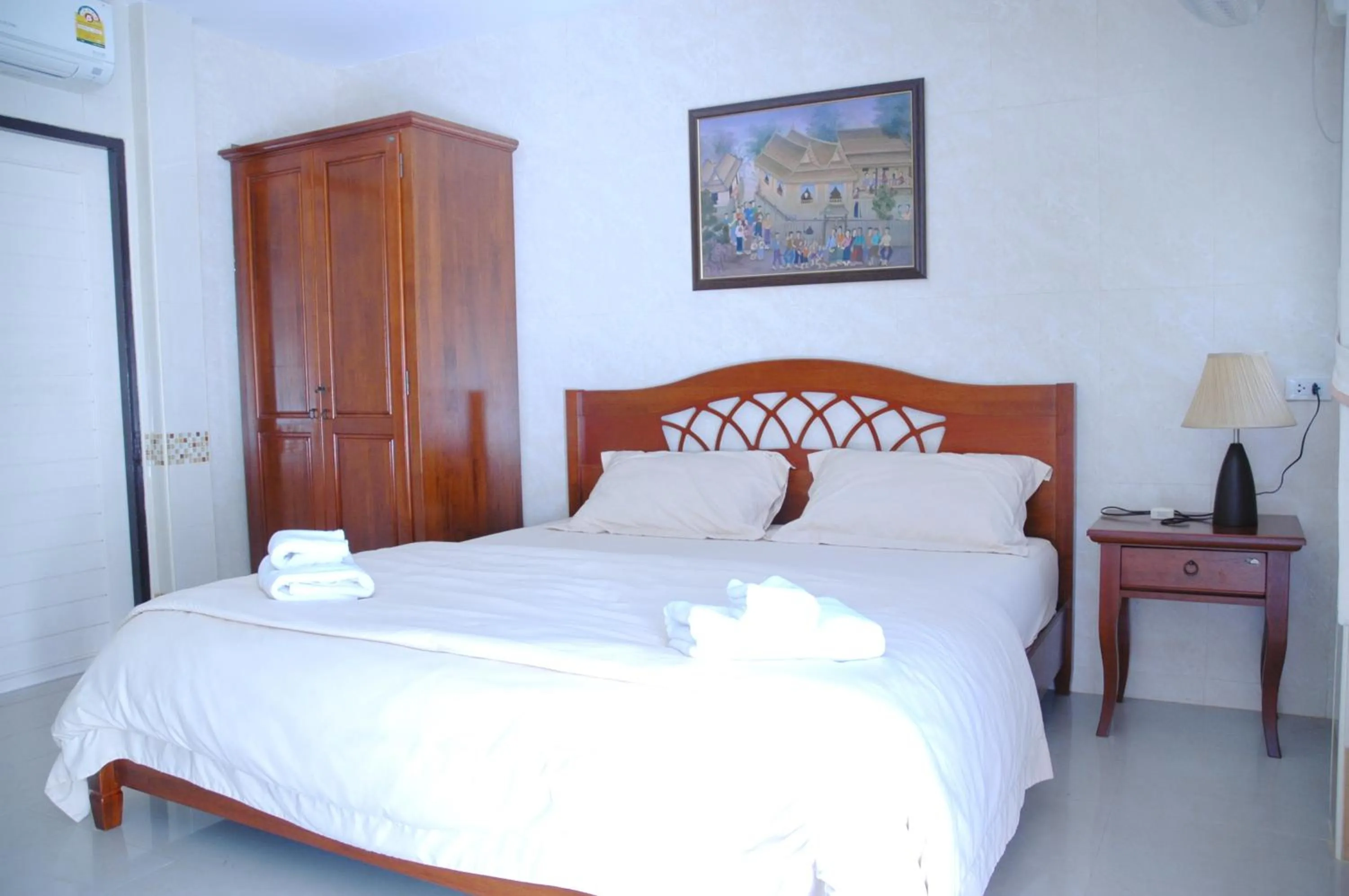Bed in Thararin Villa