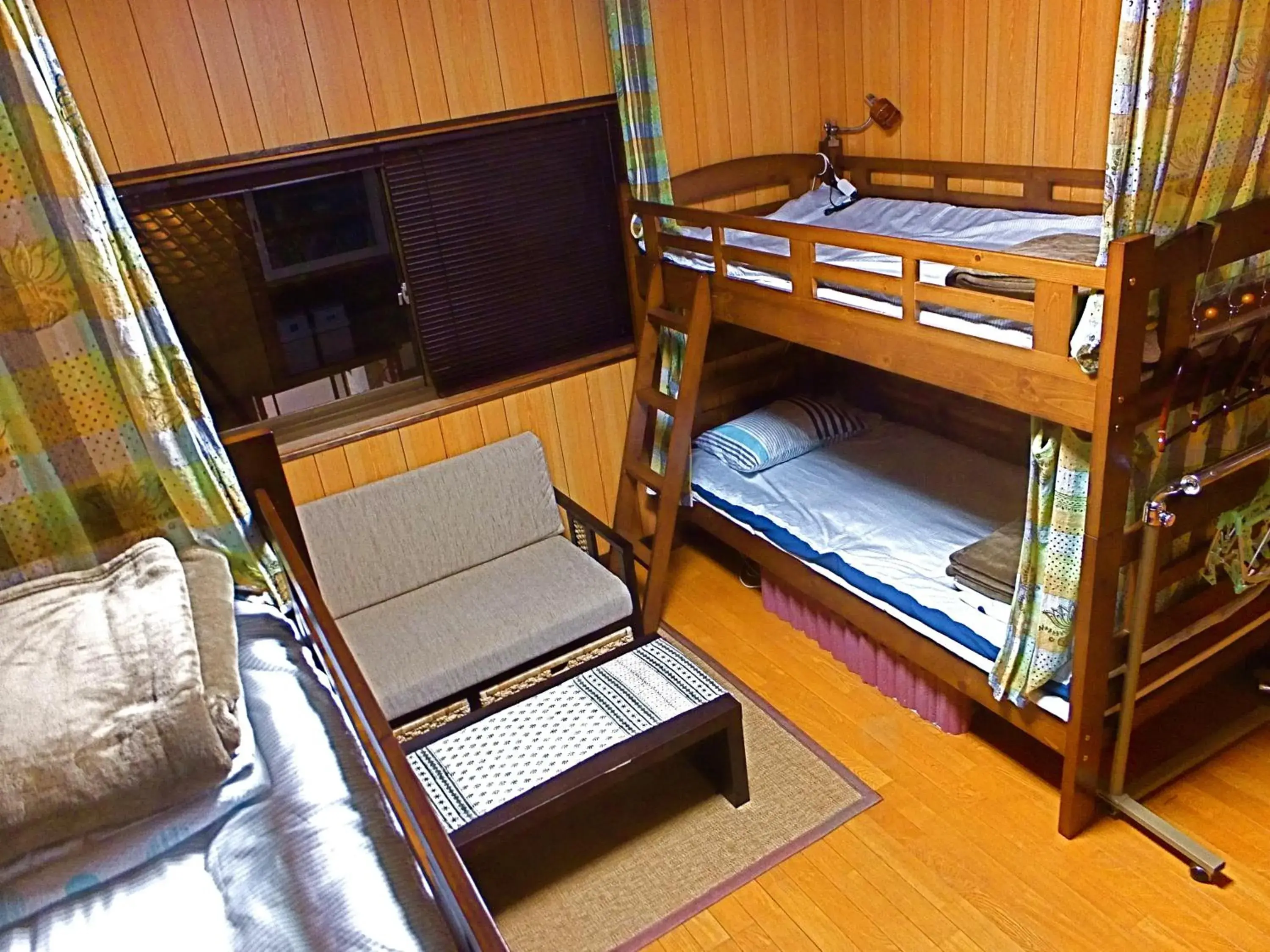 Bed in 8-Bed Dormitory Room in Aoshima Guesthouse Hooju Bed in 8-Bed Dormitory Room in Aoshima Guesthouse Hooju