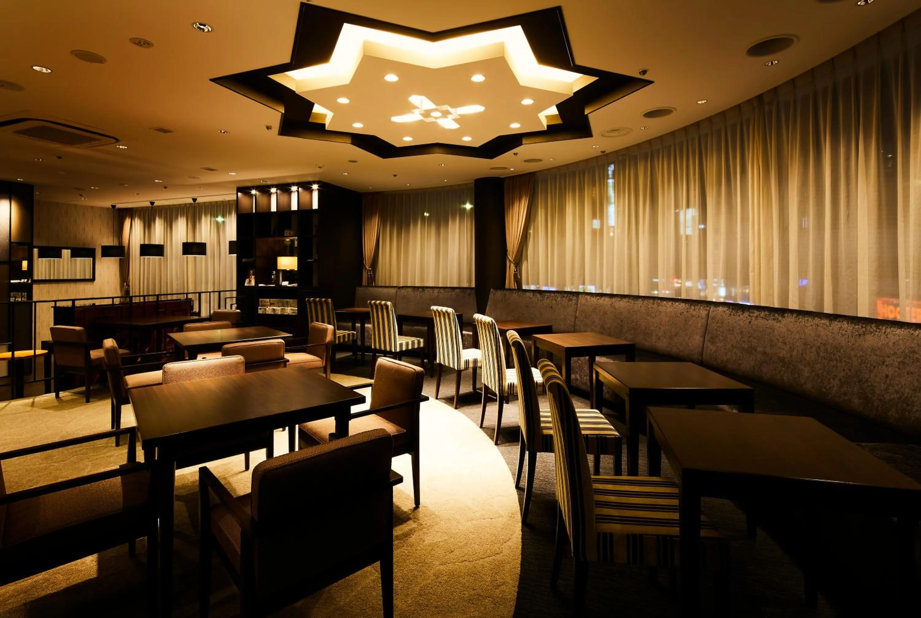 Communal lounge/ TV room in Ginza Grand Hotel