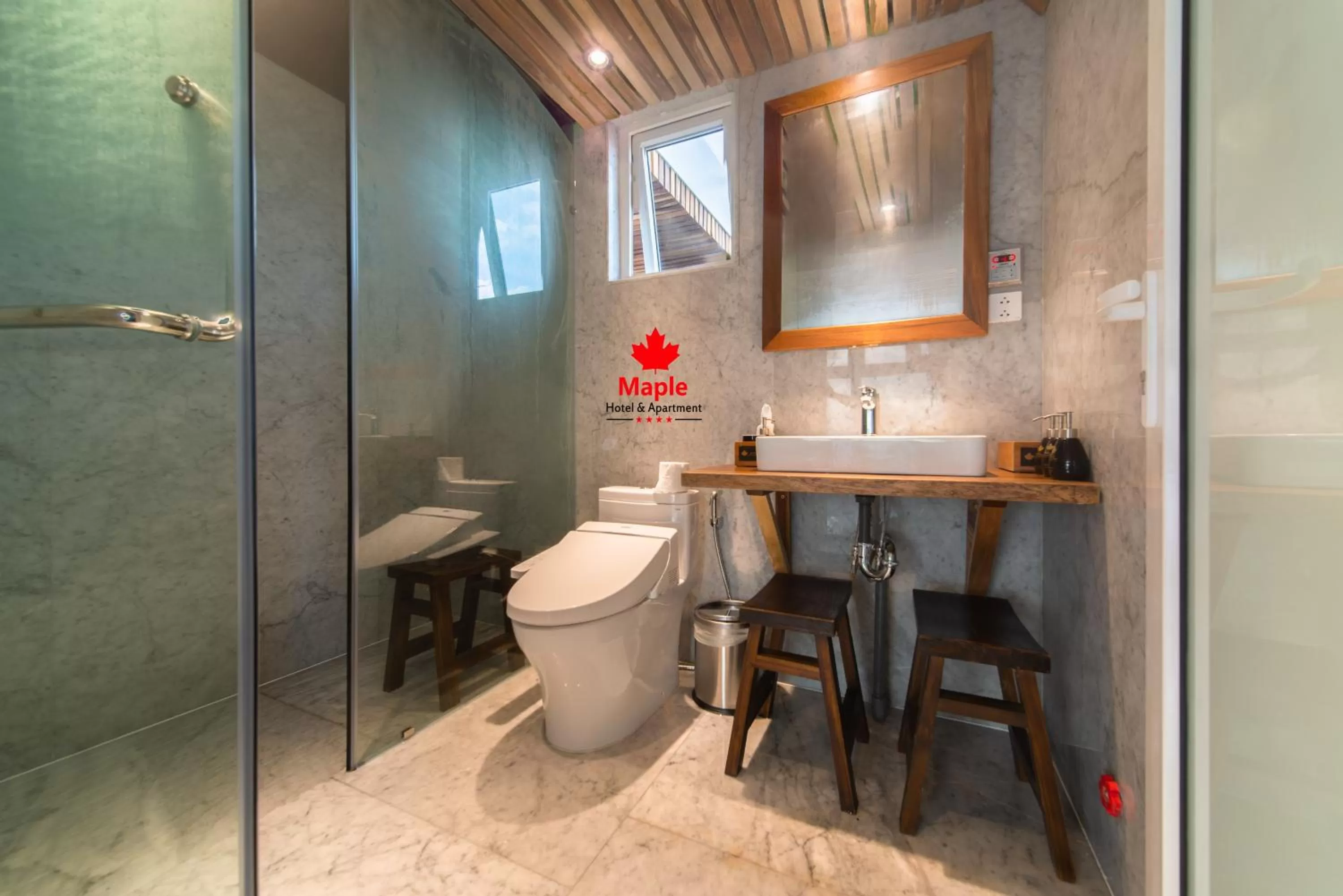 Toilet in Maple Hotel & Apartment