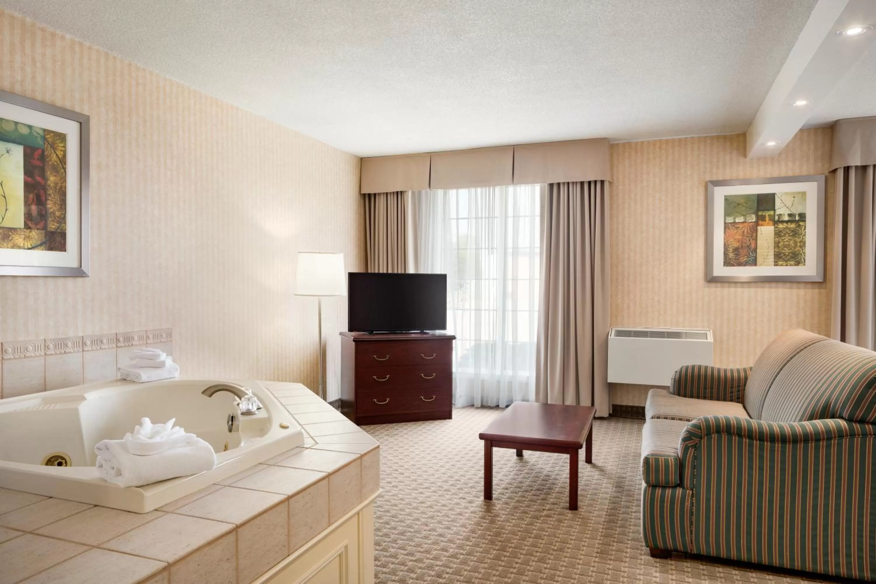 Seating area, Bed in Days Inn by Wyndham Brantford