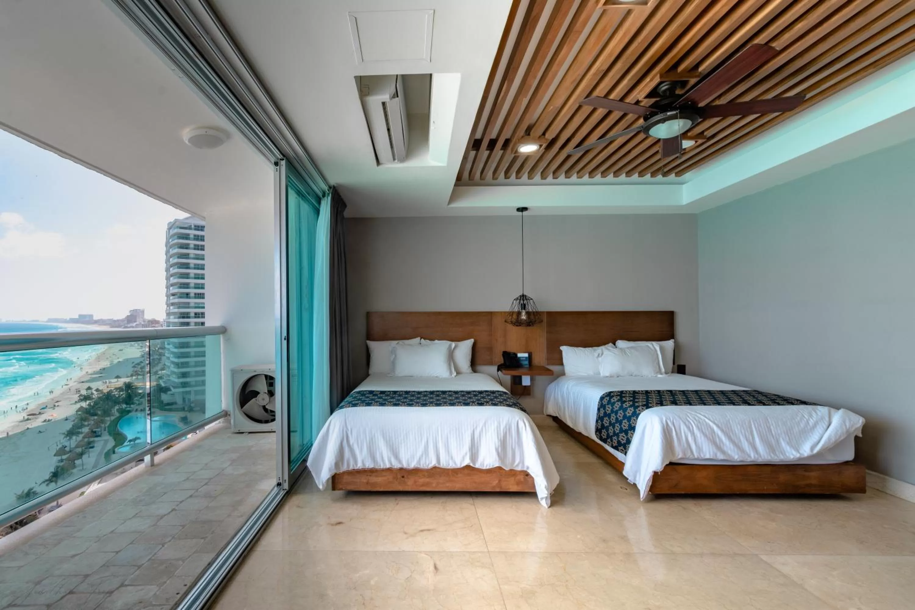 Bed in Ocean Dream Cancun by GuruHotel