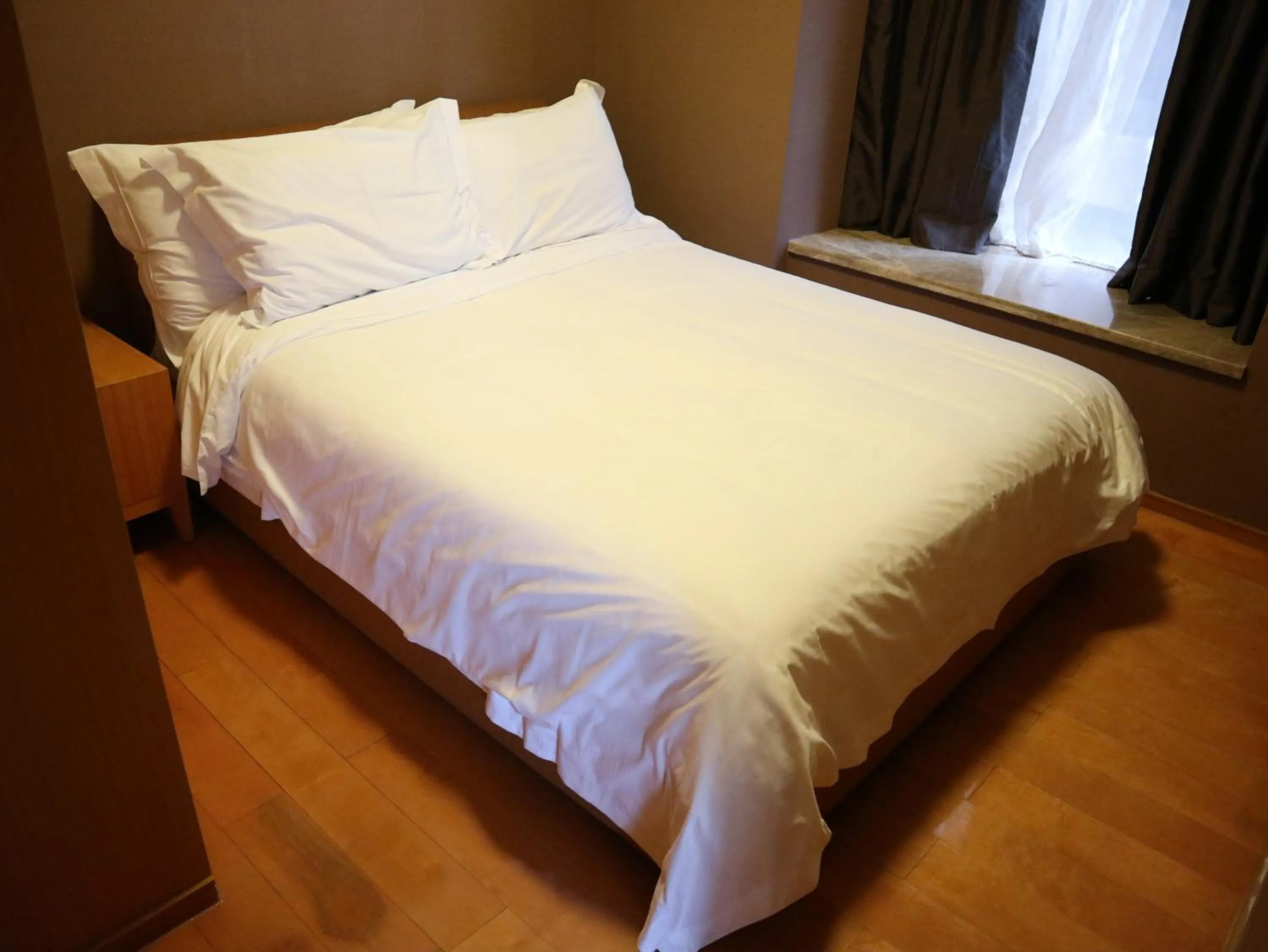 Bed in 广州丹顿行政公寓-Dan Executive Apartment Guangzhou Zhujiang New Town