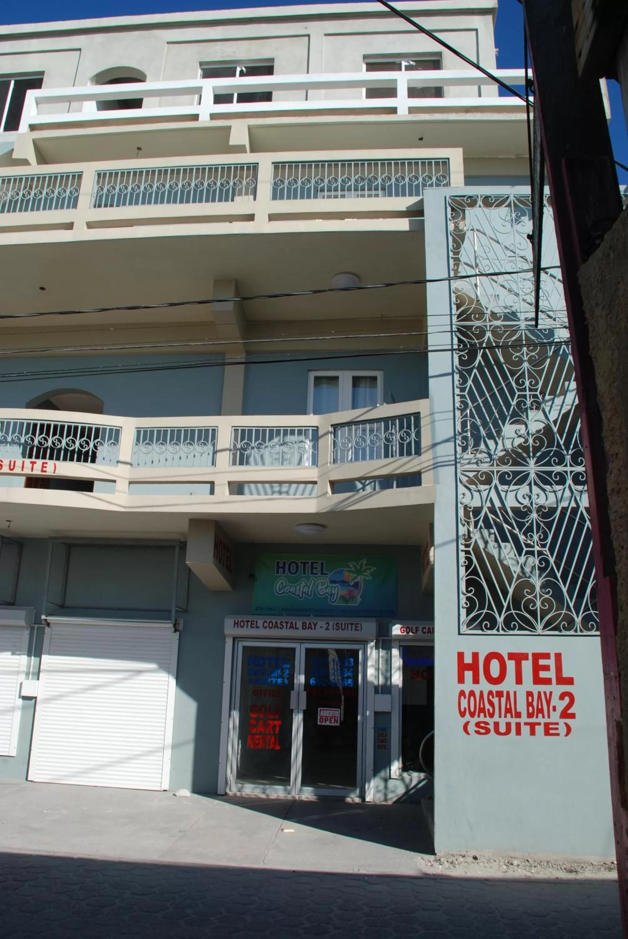 Property building in Hotel Coastalbay 2 & Golf Cart Rental