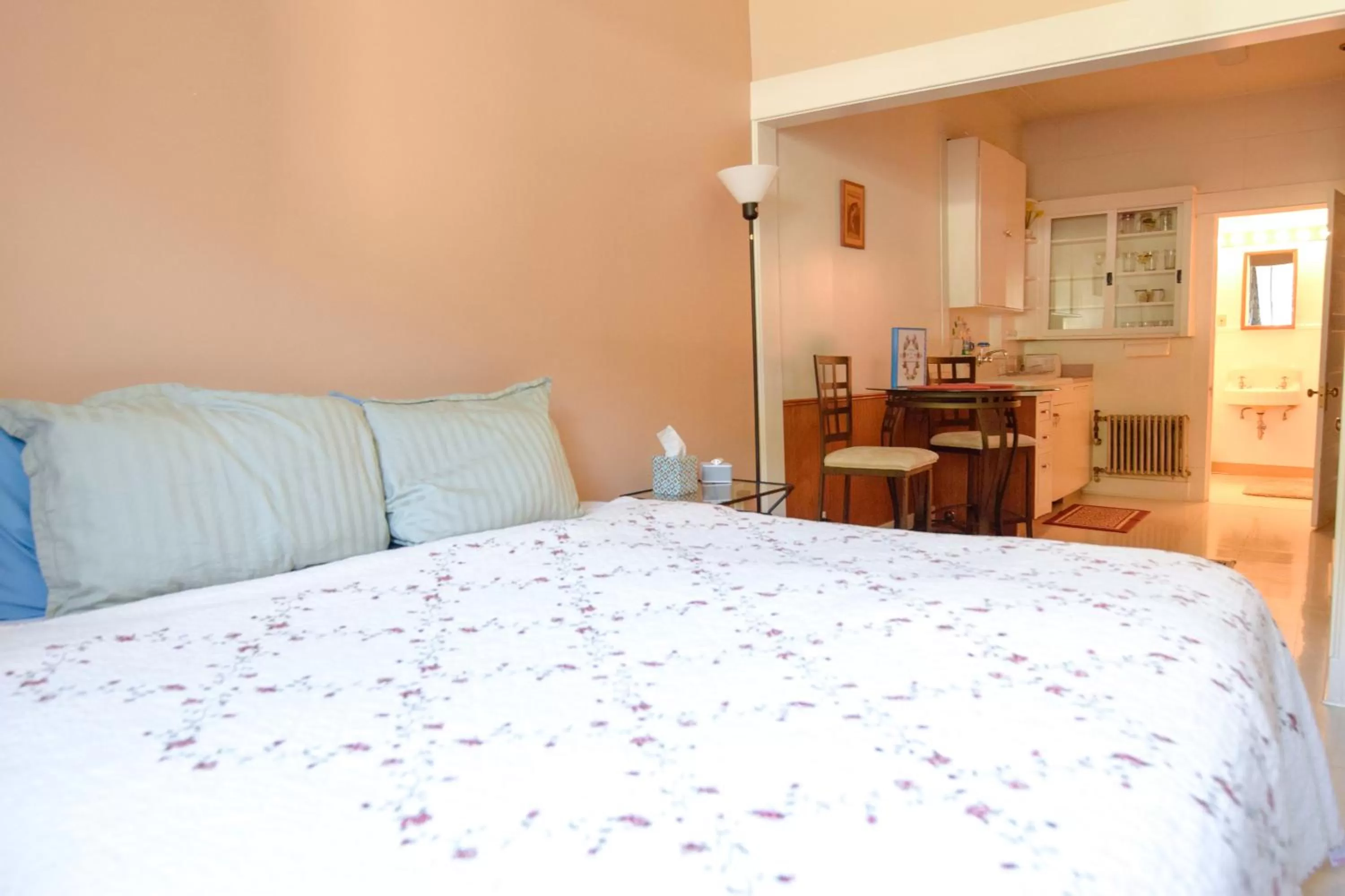 Bed in Brown & Hawkins Historical Apartments