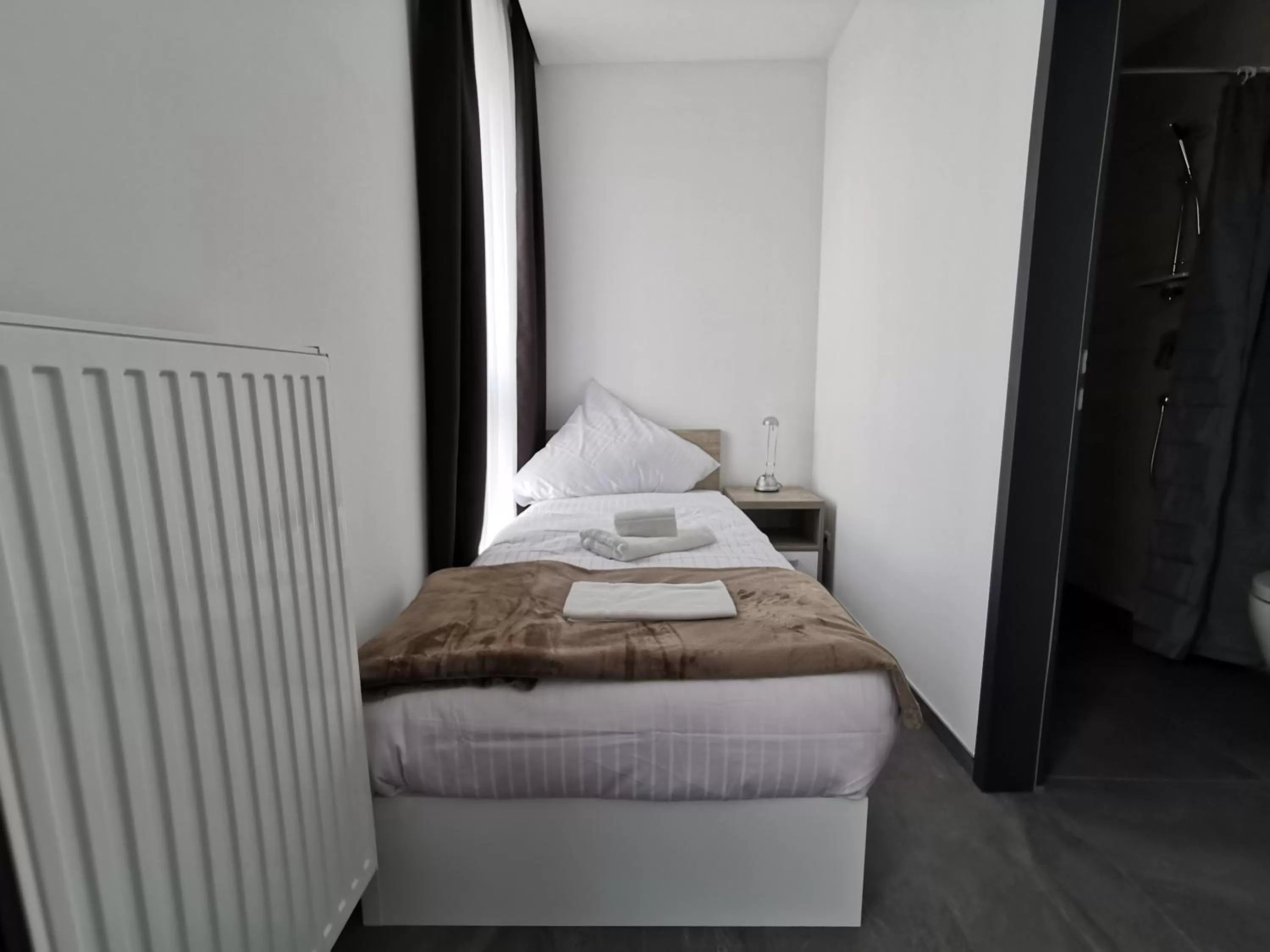 Bed in HP Apartments