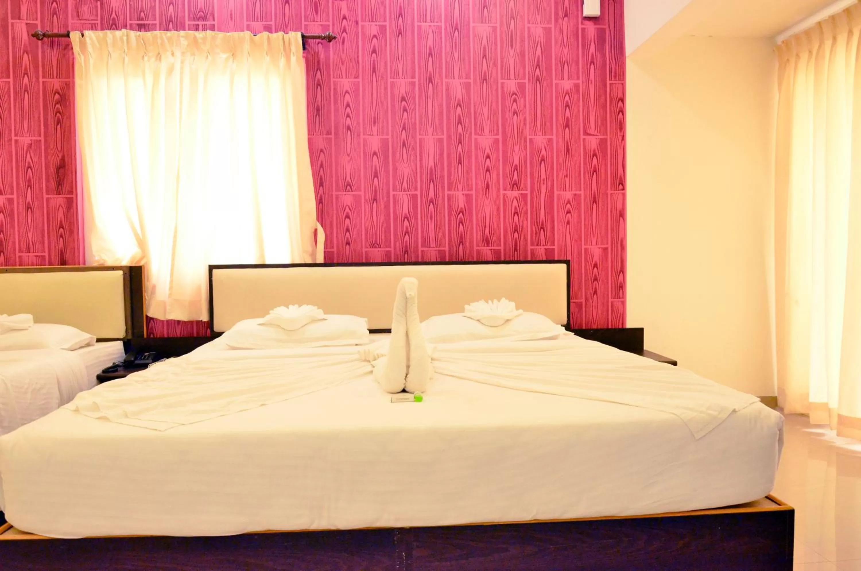 Bed in Hotel Ambai Grand