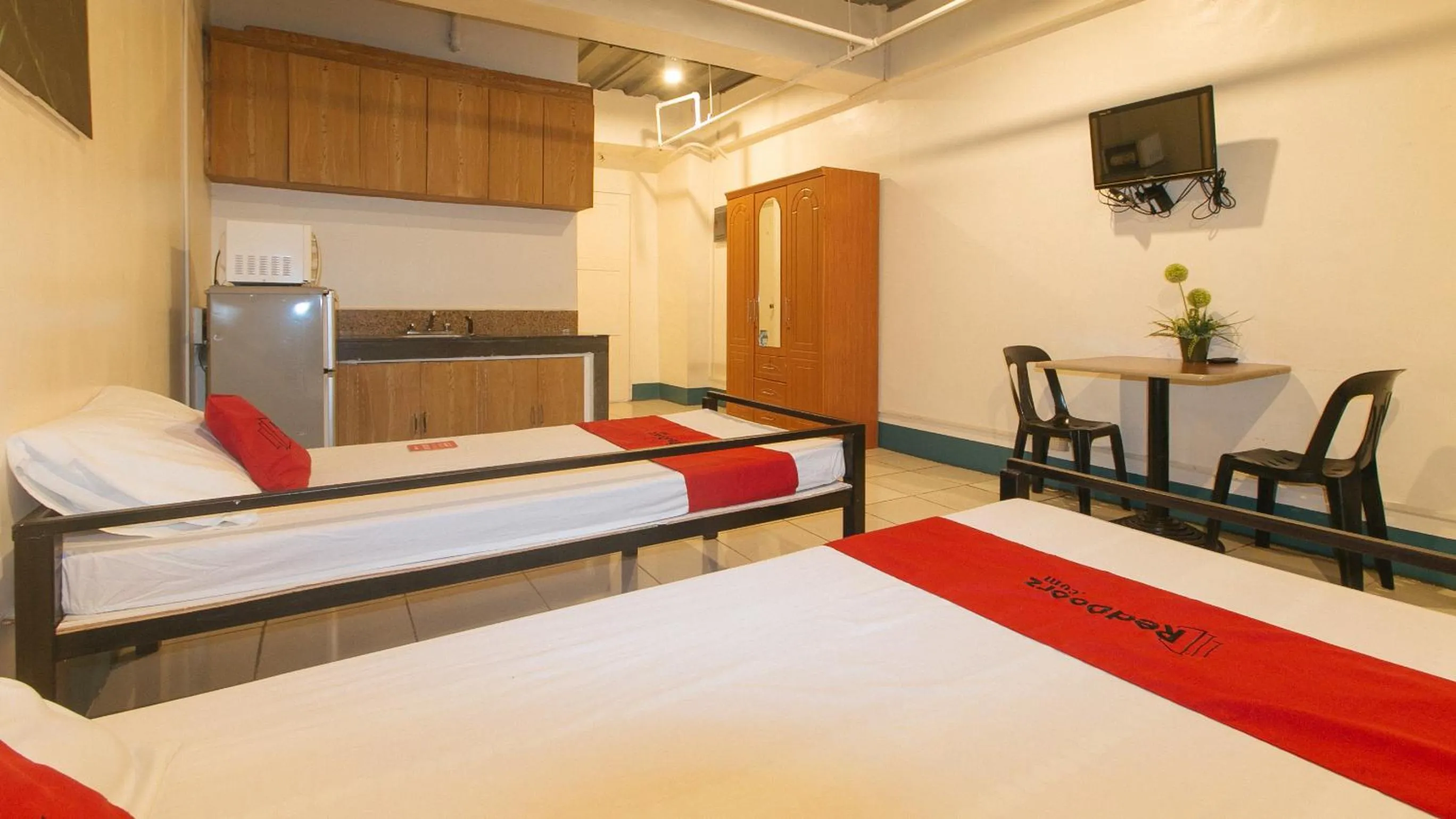 Bedroom, Bed in RedDoorz at Crowne One Condo