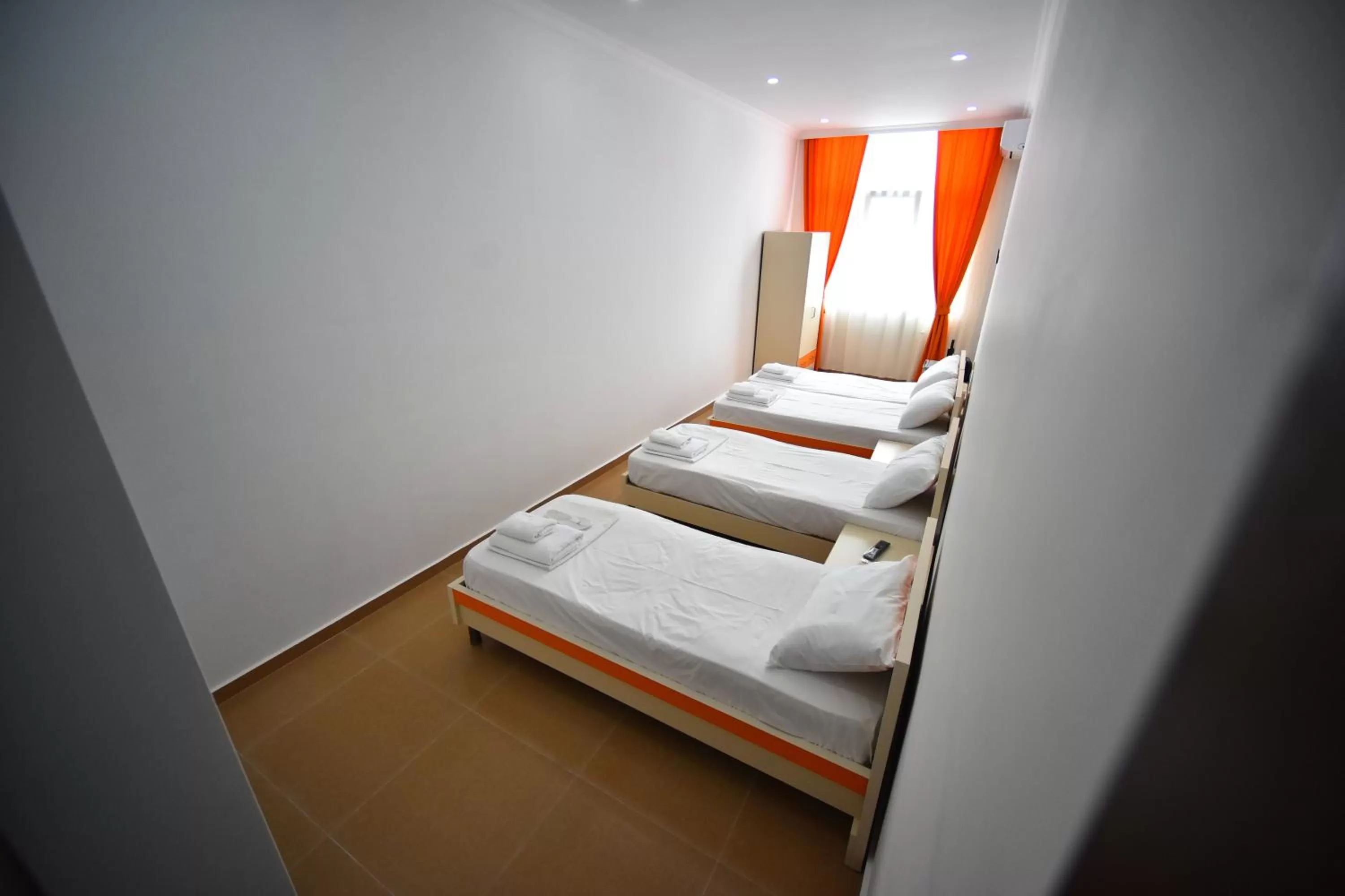 Bed in Orange Home Hotel