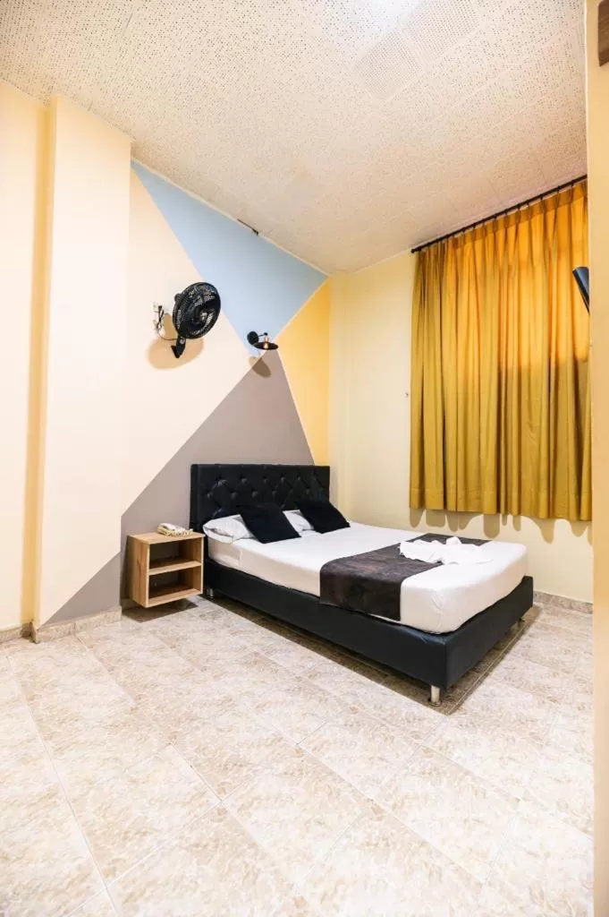 Bed in HOTEL CALLE REAL SUITE