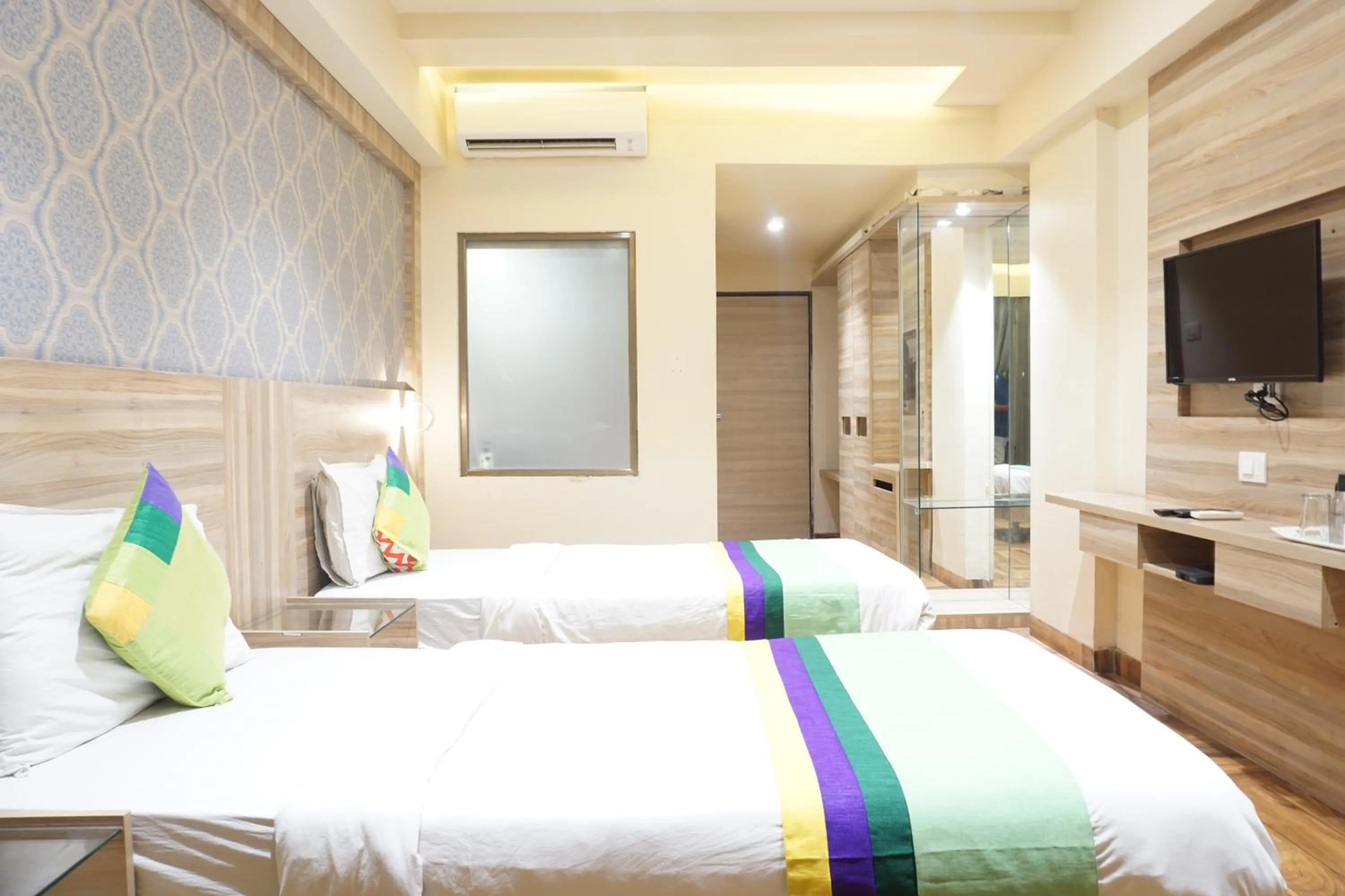 Bedroom, Bed in Treebo Classic Grande, Camp