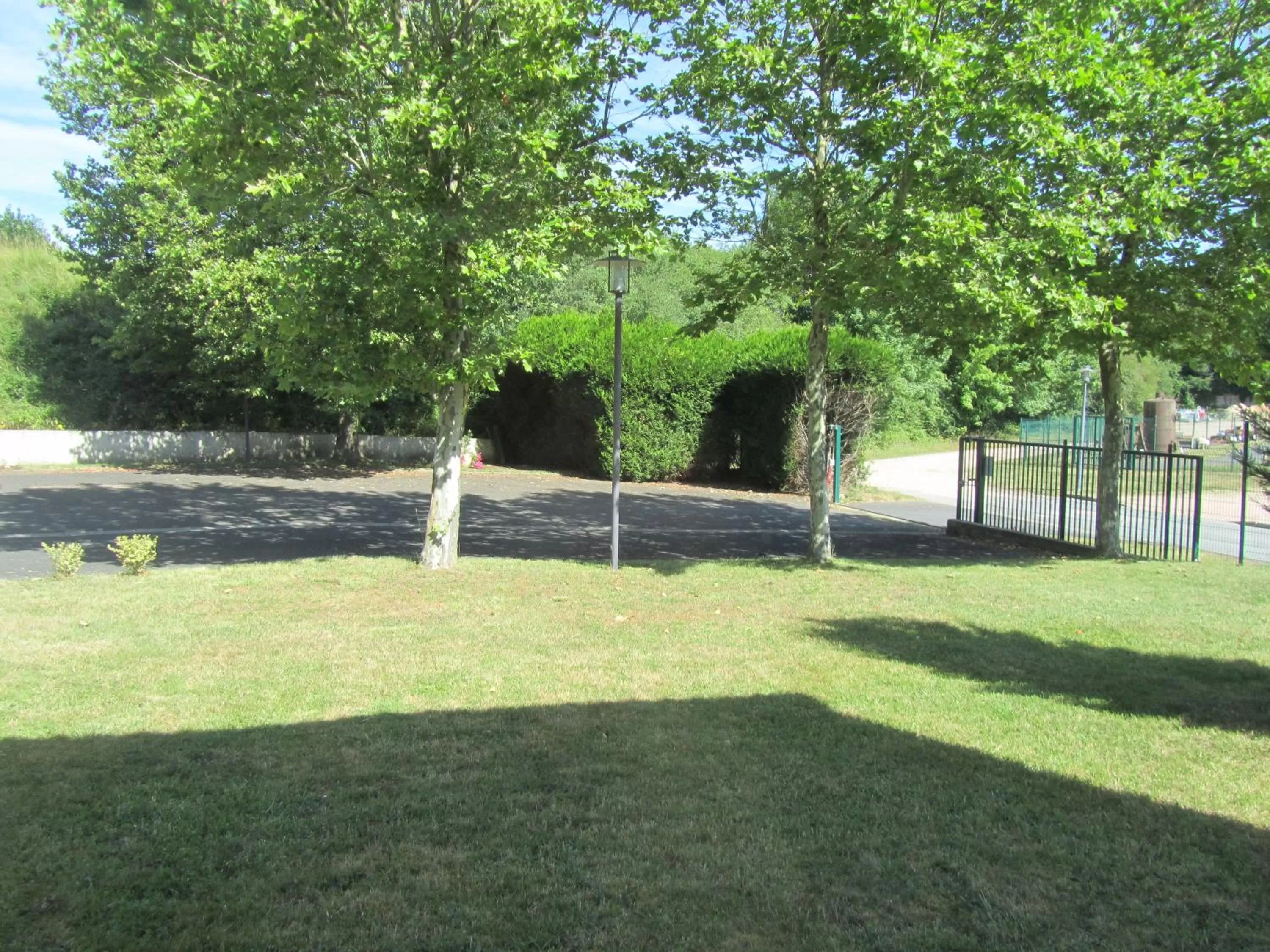 Garden view in Hôtel Le Saint Joseph